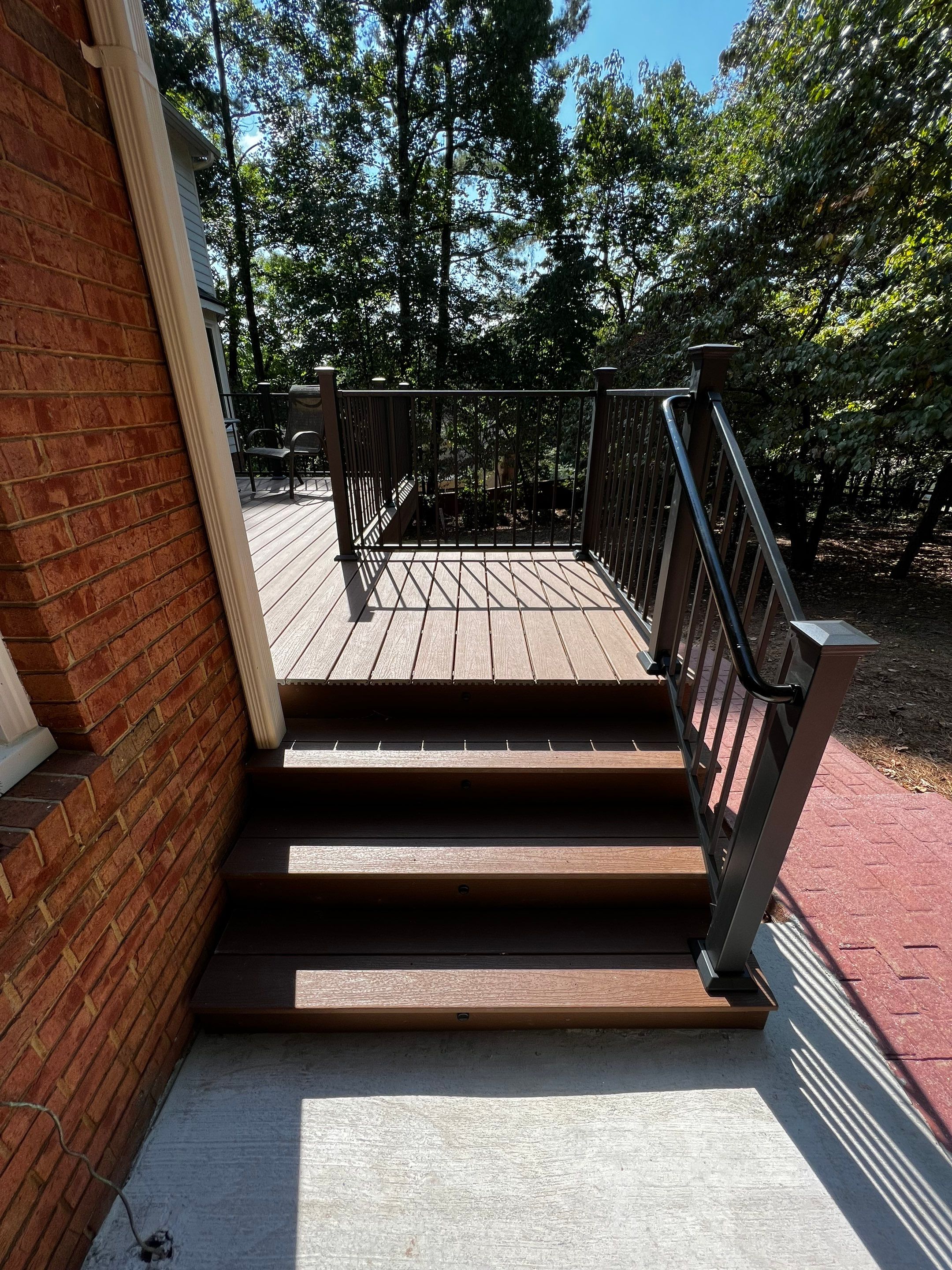 Elevated Composite Deck Installation with Metal Railings in Atlanta by Swift Home Renovations