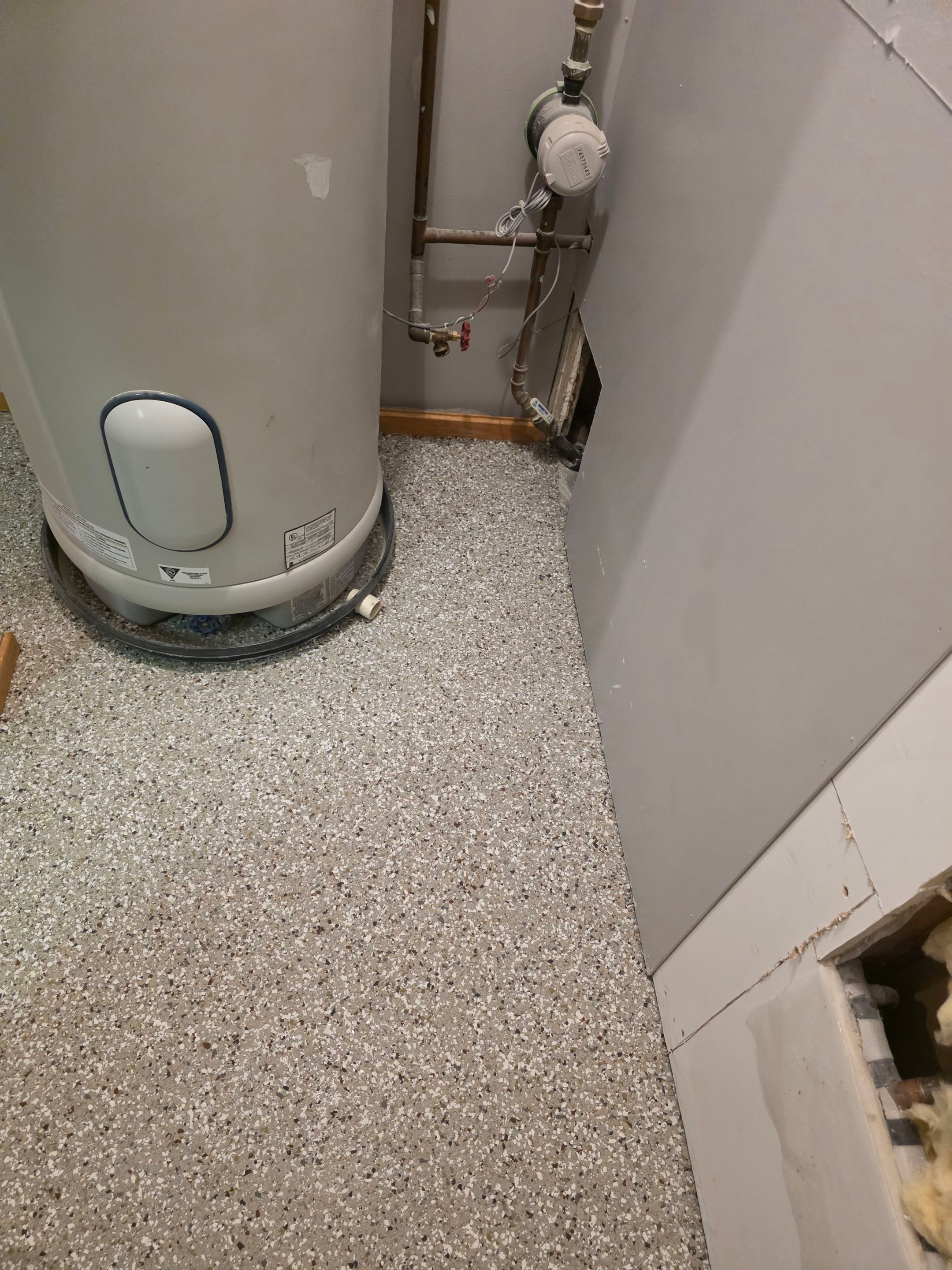 Full Garage and Basement Epoxy Floor Coating in Winner by Select Painting, Coatings & Garage Cabinets