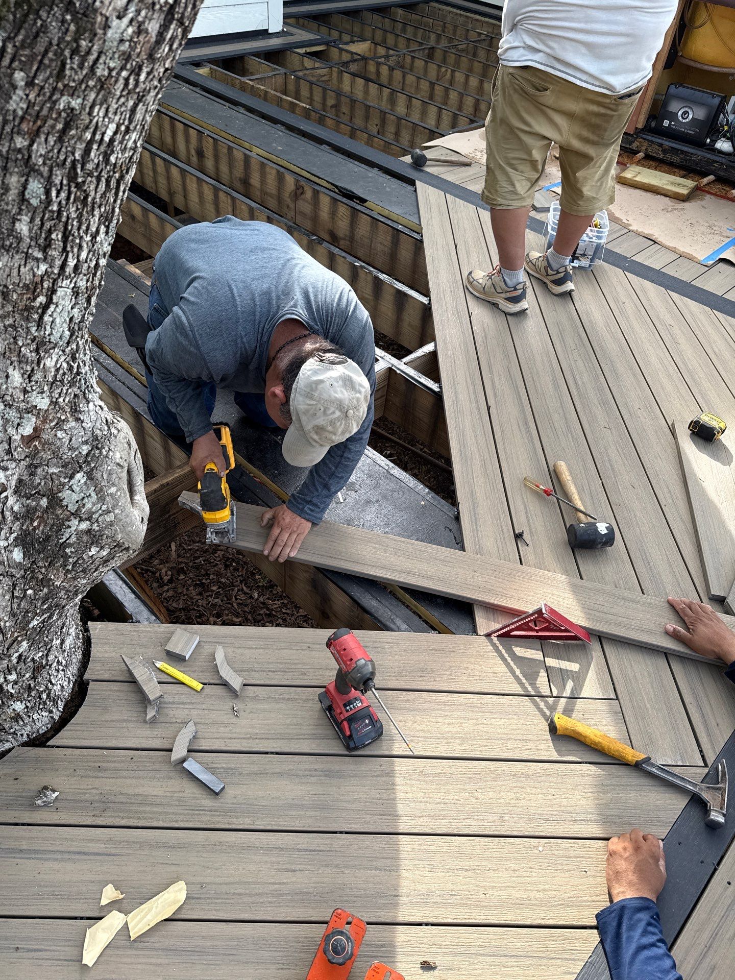 Deck Resurface with Glass Paneling and Deckorators Voyage Series Products by Nelson Exteriors 