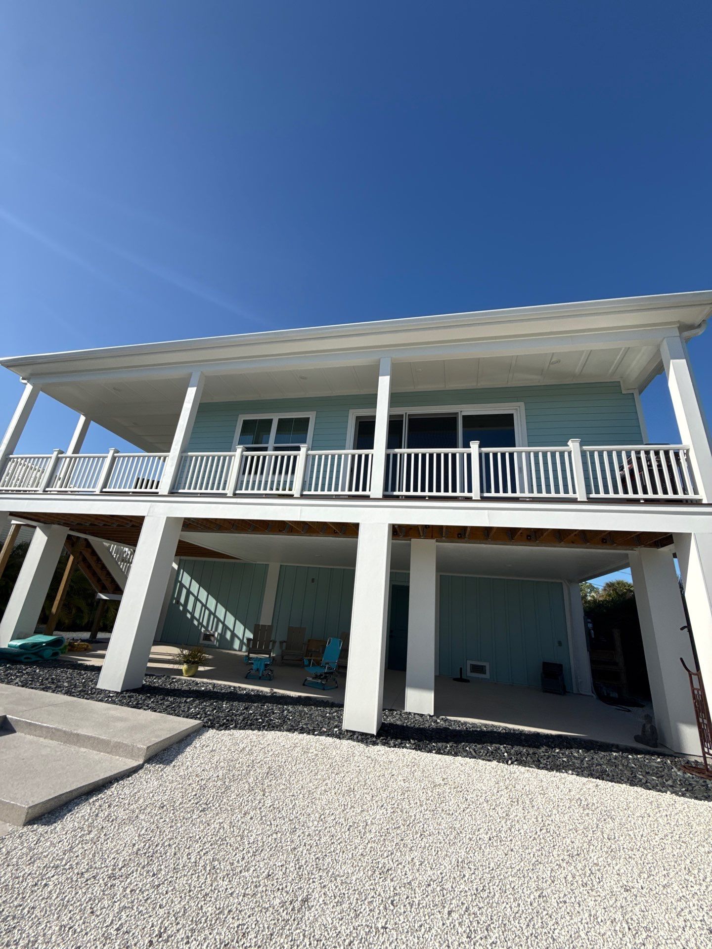 New White Seamless Gutters Installation and Downspouts, Reseal Gutters in Fort Myers Beach, FL  by Gutter Professors
