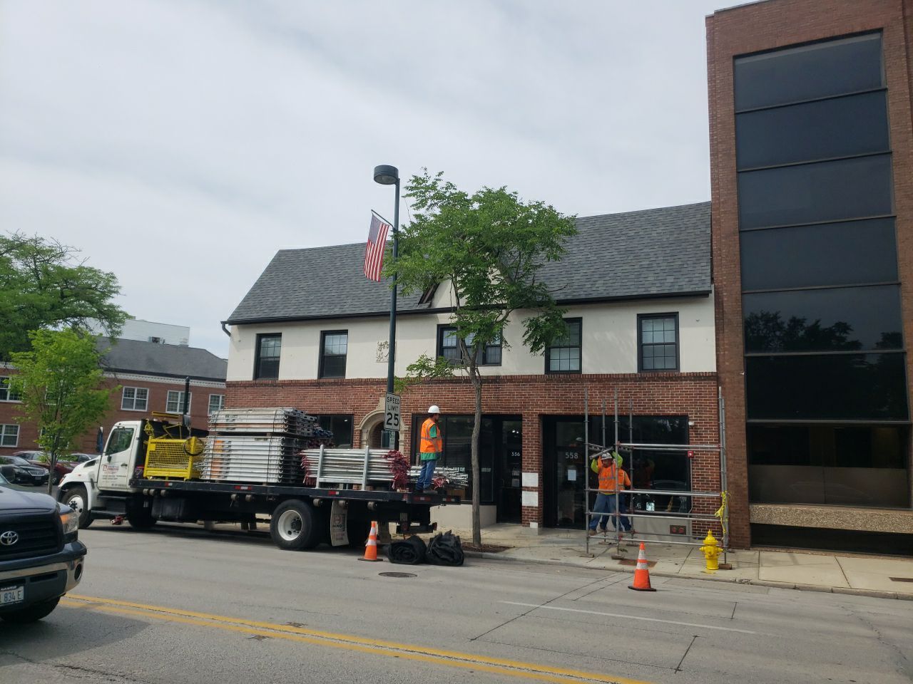 Asphalt Roof Replacement with Aluminum Gutter Installation by Custom Installations