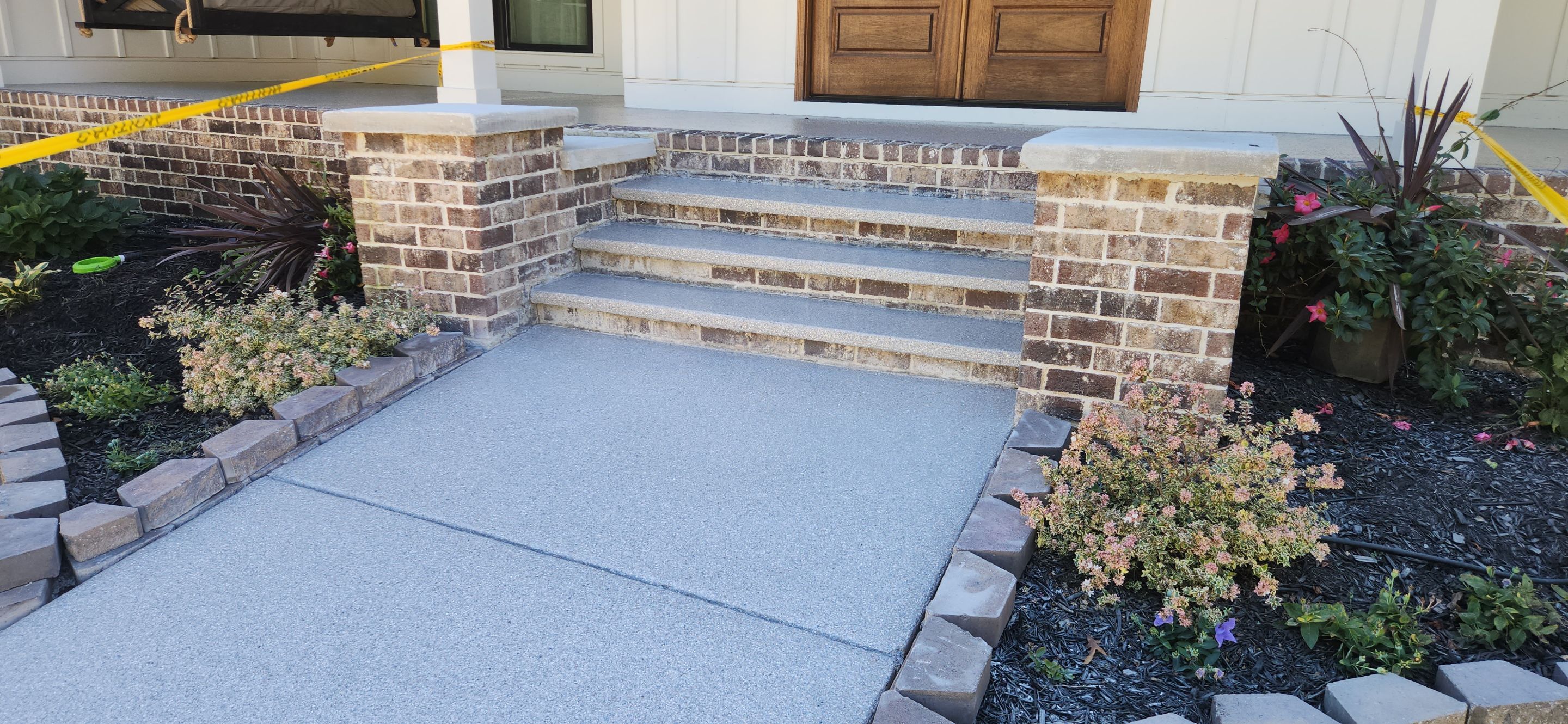Front Porch and Garage using Coyote & Pumice by Elite Floor Solutions