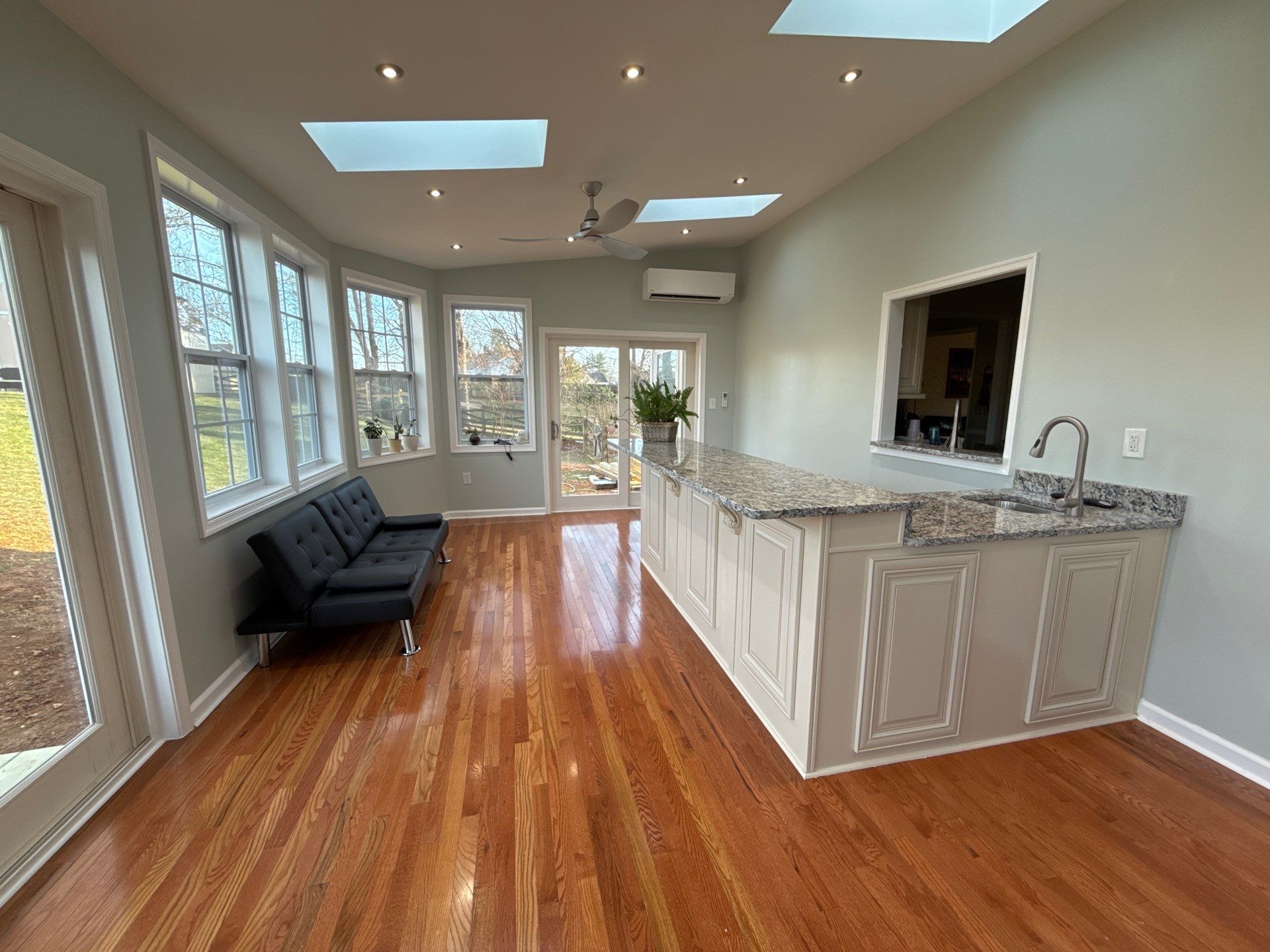 Sun room  using Concrete wood lumber, insulation , drywall, painting , cabinets , laminate floor  . by Jesus Master Handyman LLC 