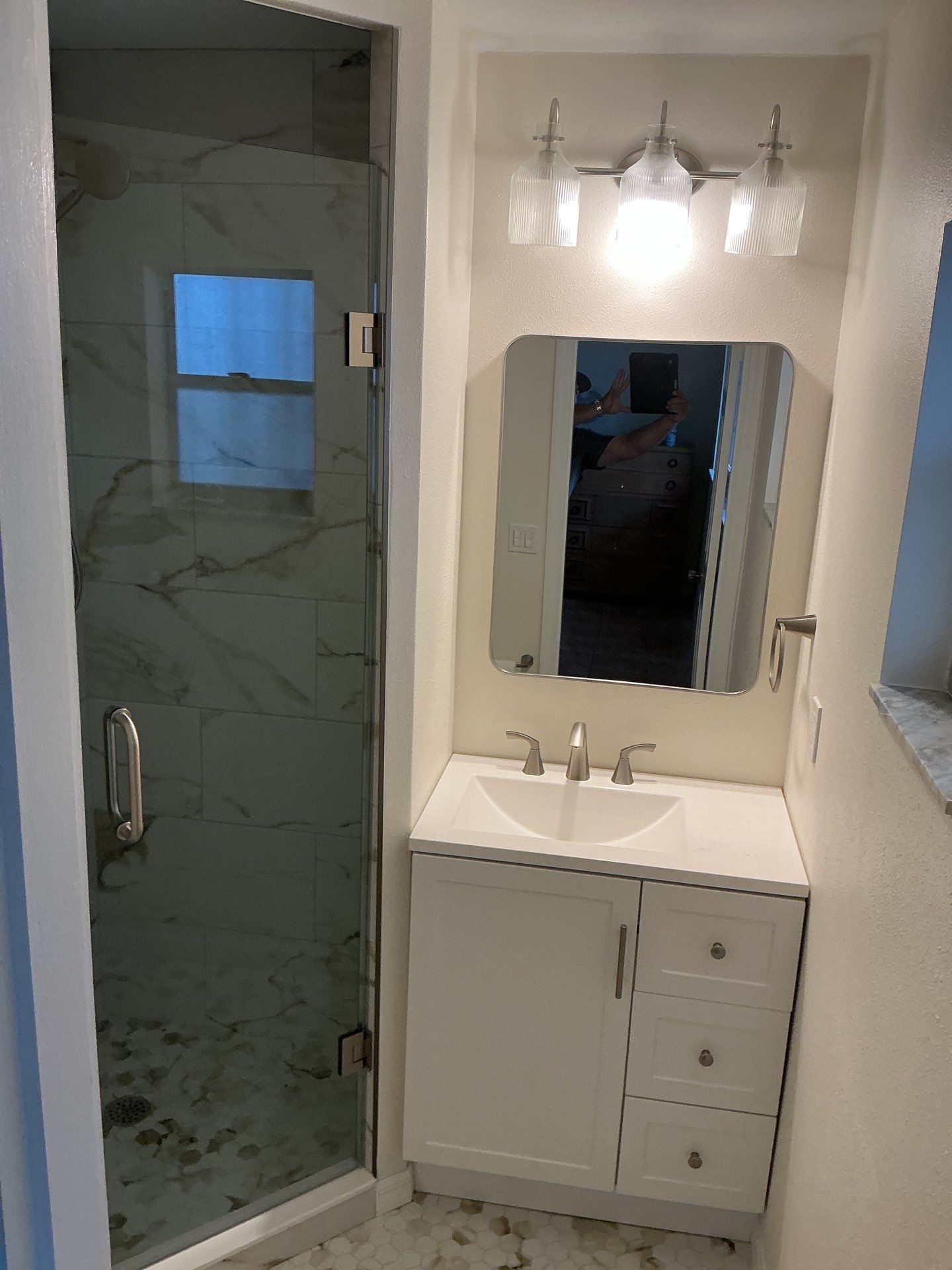 Modern Bathroom Remodel Featuring Marble Tile in Ormond Beach by Acies Renovations