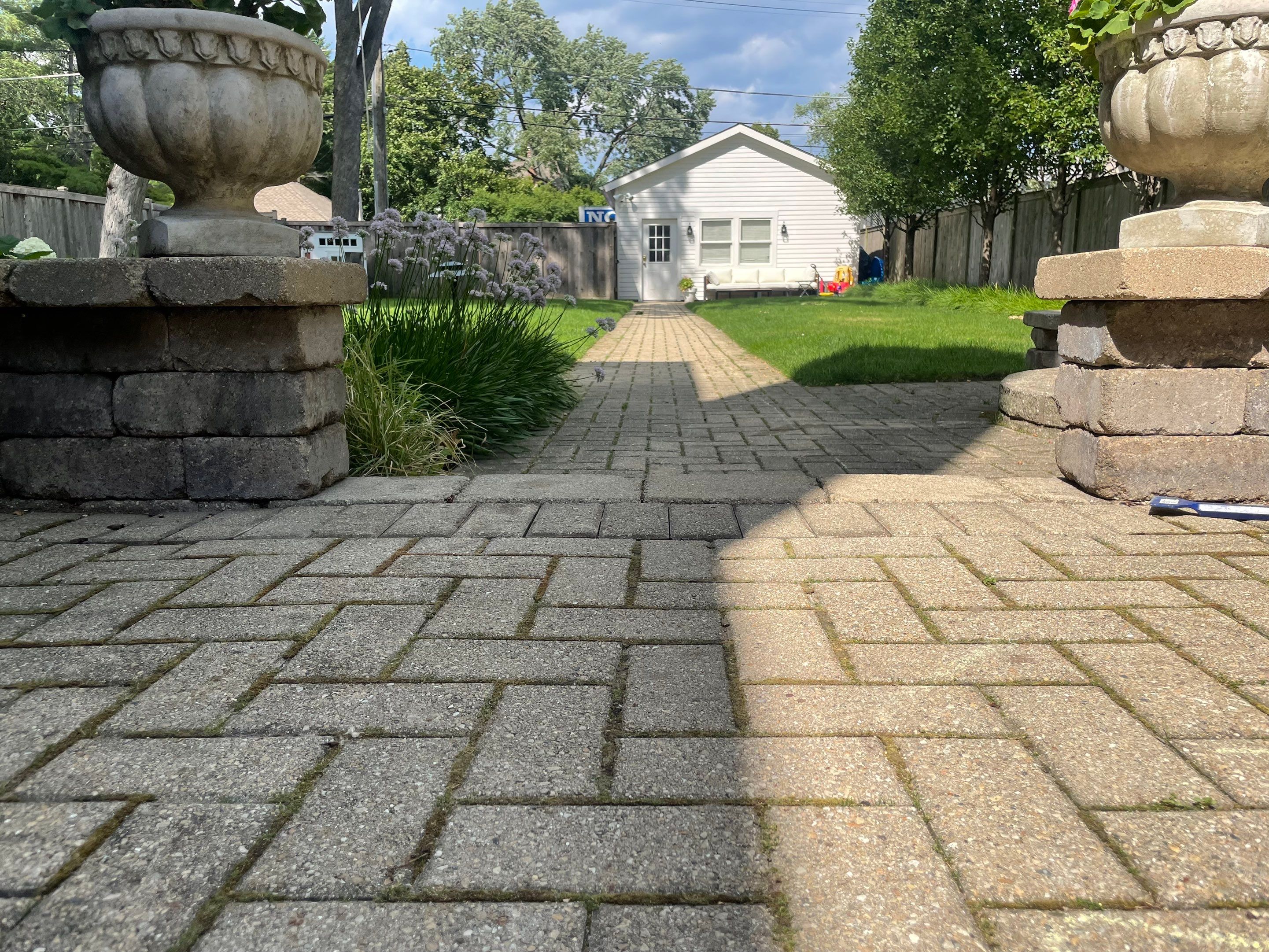 Brick patio repair, clean sand and seal by Northern Power Washing LLC.