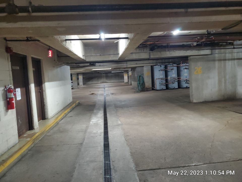 Parking garage using Hot water by Northern Power Washing LLC.