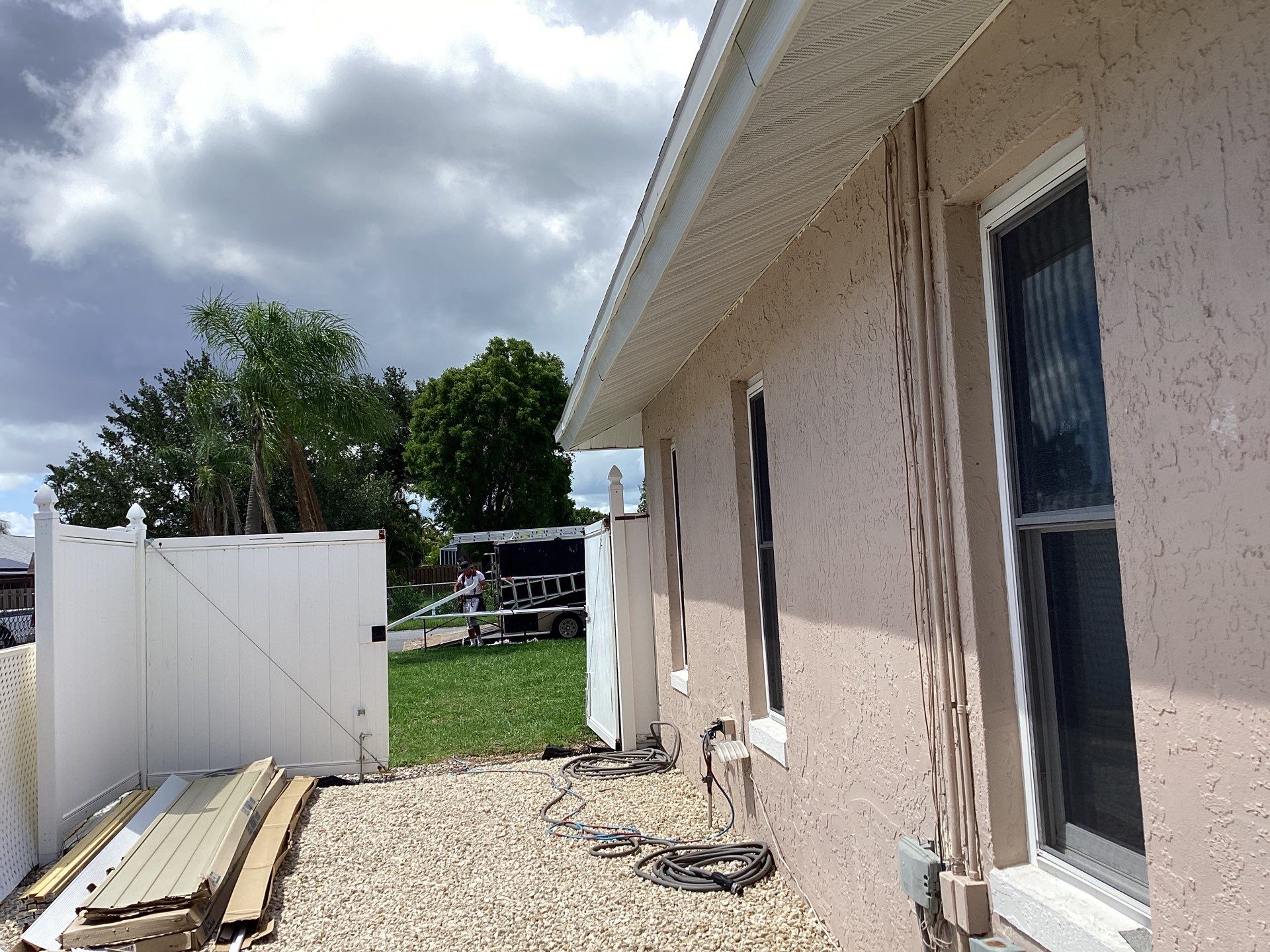 White Seamless Gutters and Splash Guards in Fort Myers FL by Gutter Professor by Gutter Professors