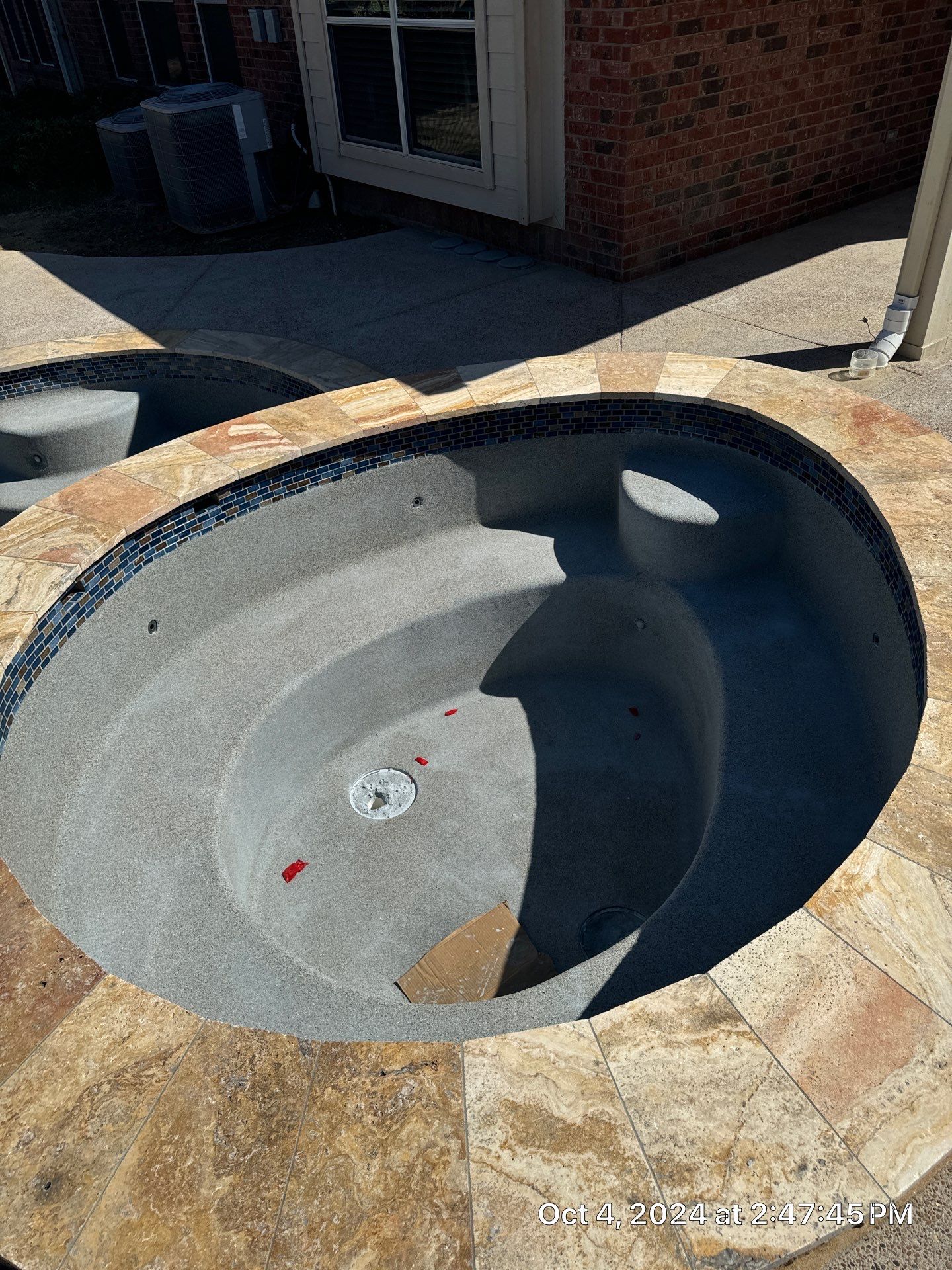 Freeform Pool and Spa with Raised Stone Water Wall by Pinnacle Pools and Spas - DFW