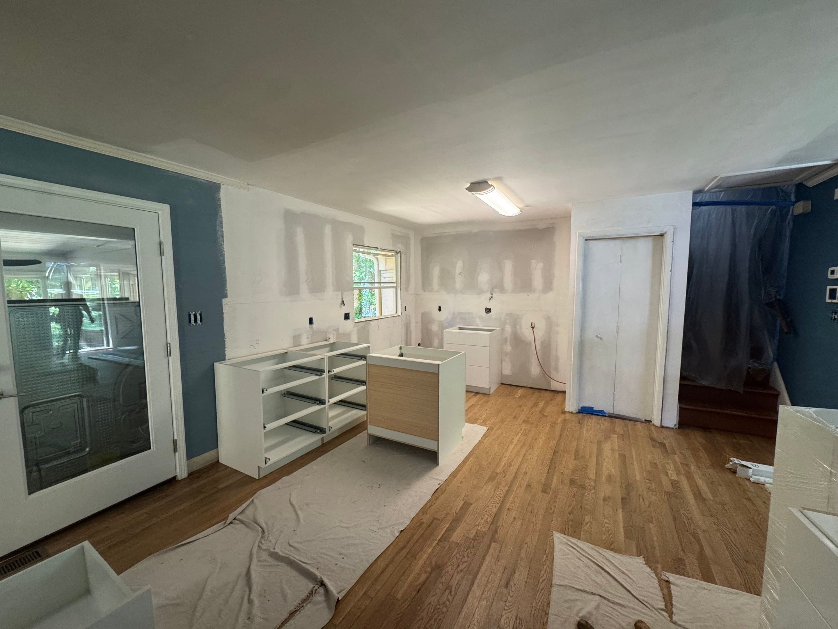 Modern Kitchen Remodeling with Large Central Island in Doraville by Swift Home Renovations