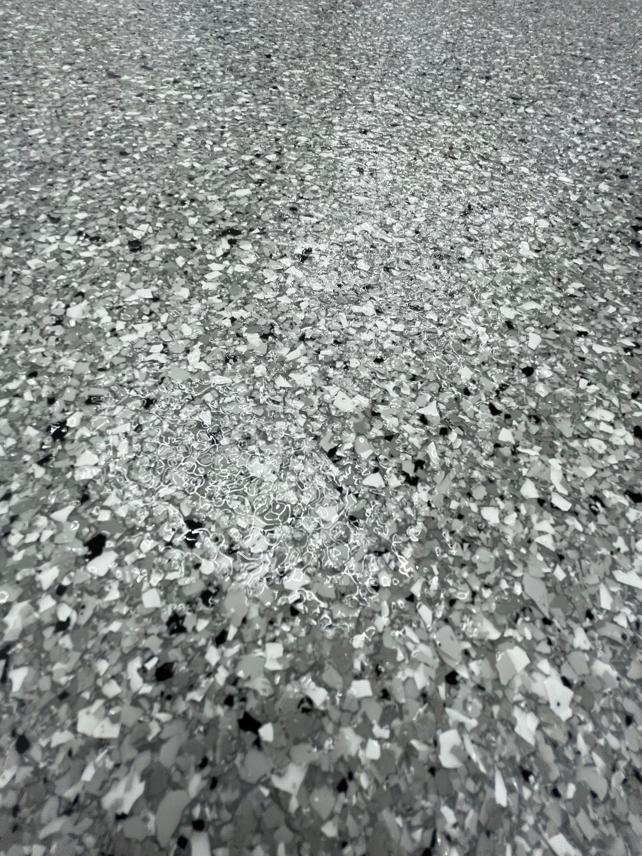 Feather Gray Epoxy Floor Coating Installation in Sioux Falls by Select Painting, Coatings & Garage Cabinets