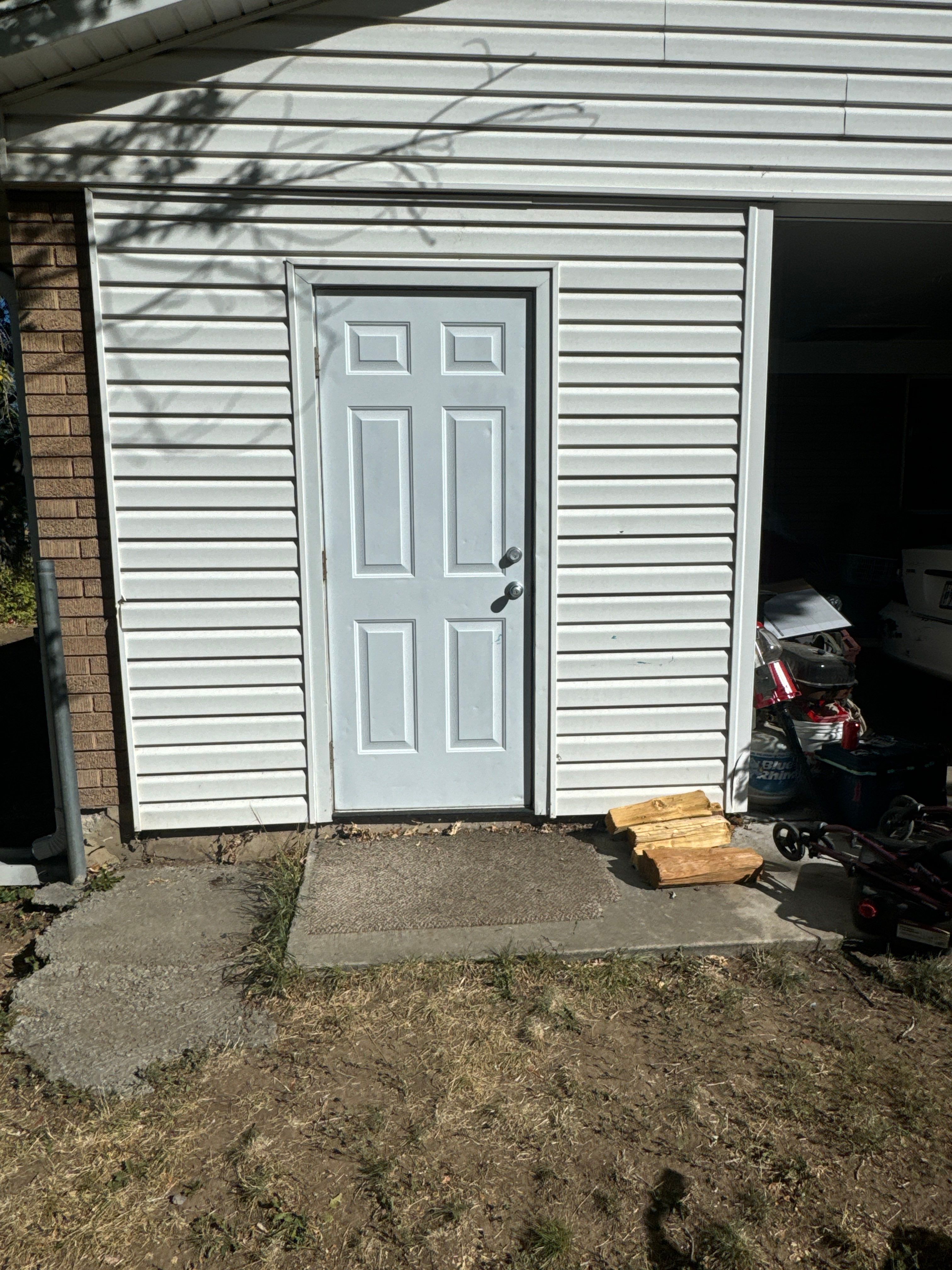 Salt Lake Area | Targeted Vinyl Siding & Door Trim Repair | Crisp White by Ideal Siding Utah