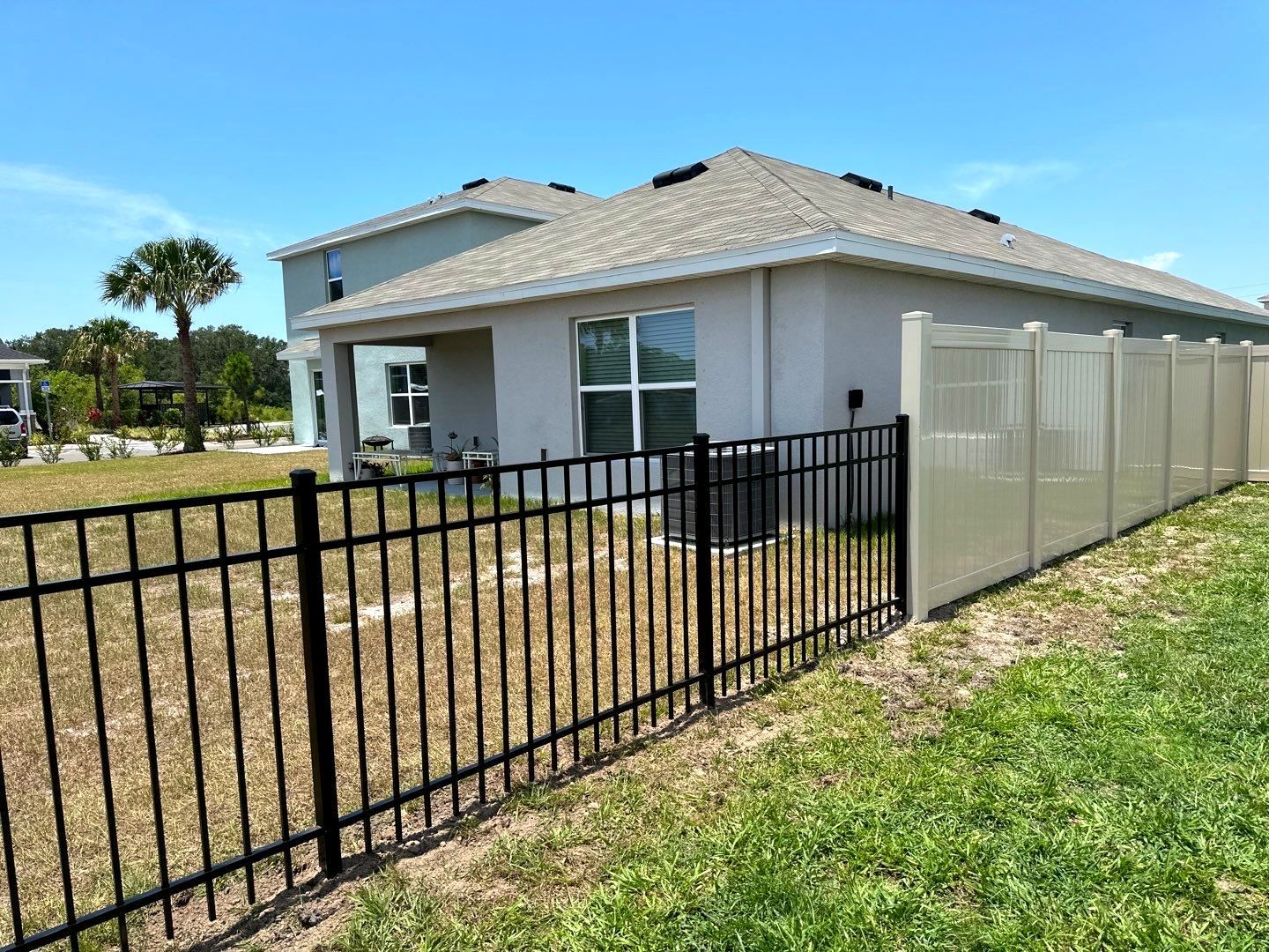 Aluminum Fence Installation using Black 3 Rail Aluminum Fence and Tan Vinyl Privacy Fence by Asap fence and gates, LLC