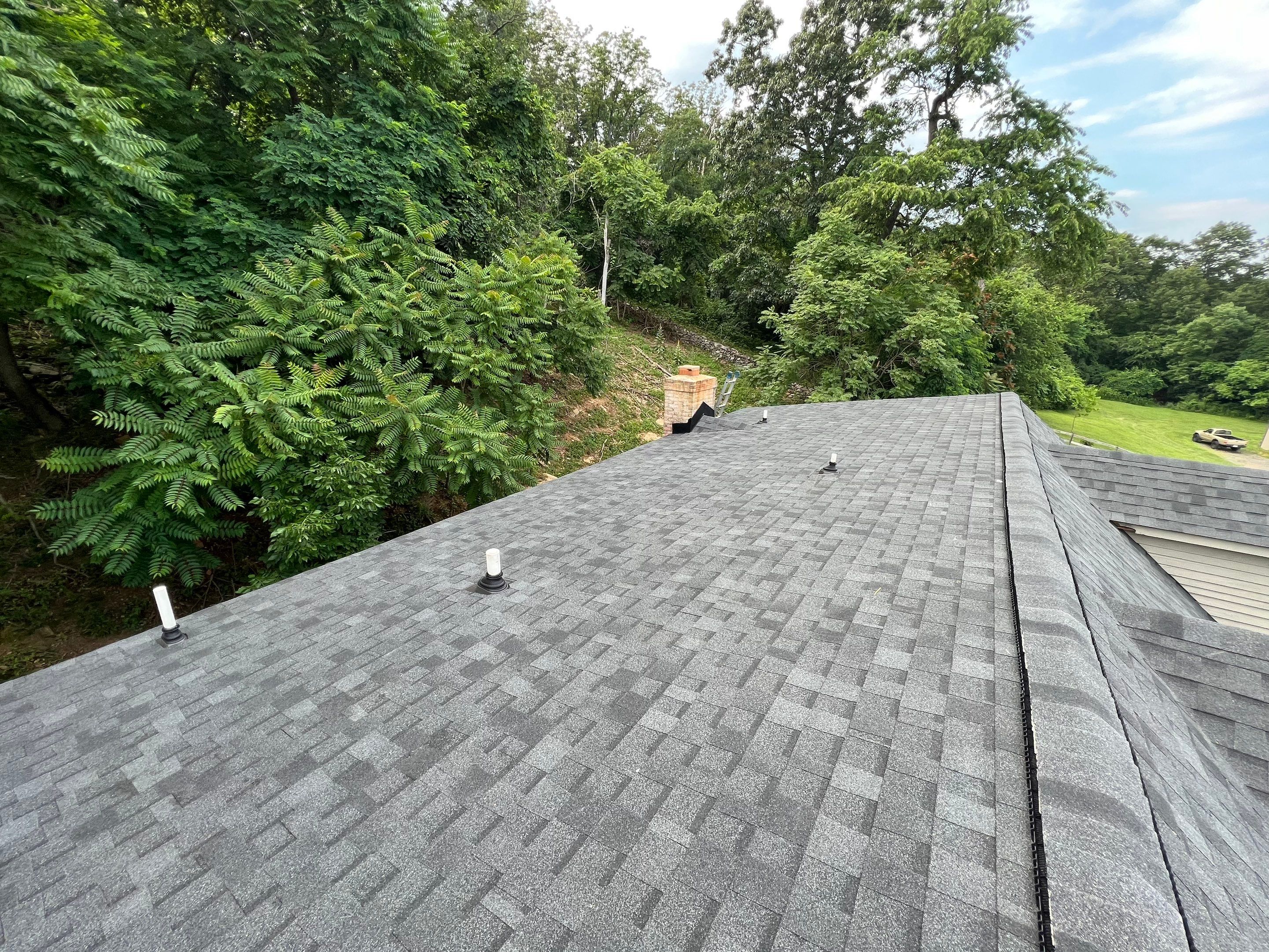Residential Roofing Installation using Atlas Pinnacle Pristine Black Architectural Shingles by Frederick Roof Repair