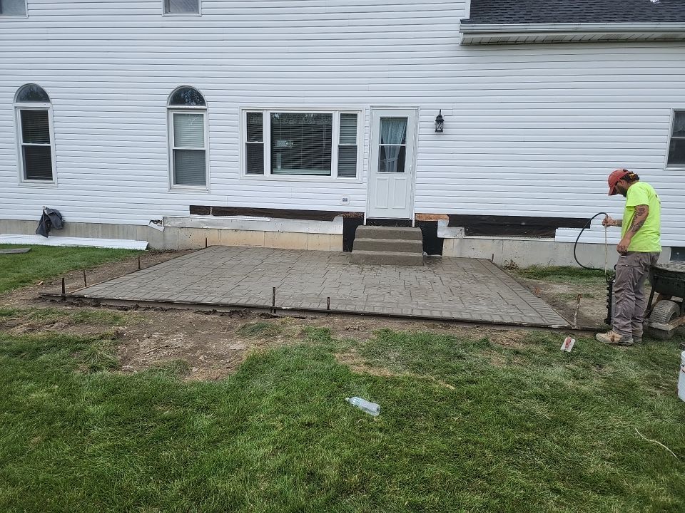 Stamped Concrete and Entry Door by Ivy Lea Construction