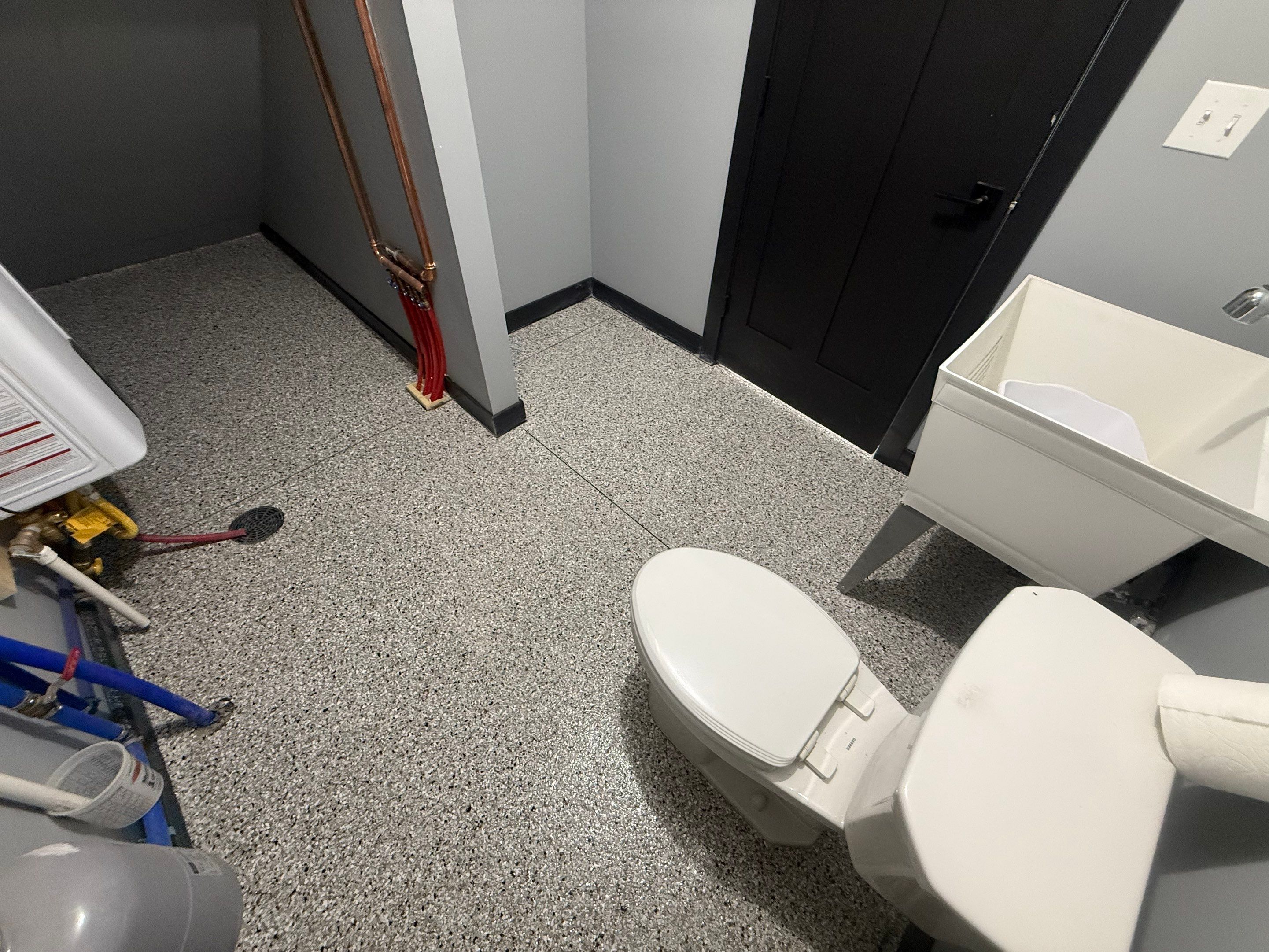 Polyaspartic Garage Floor Coating with Decorative Flake in Wentworth by Select Painting, Coatings & Garage Cabinets