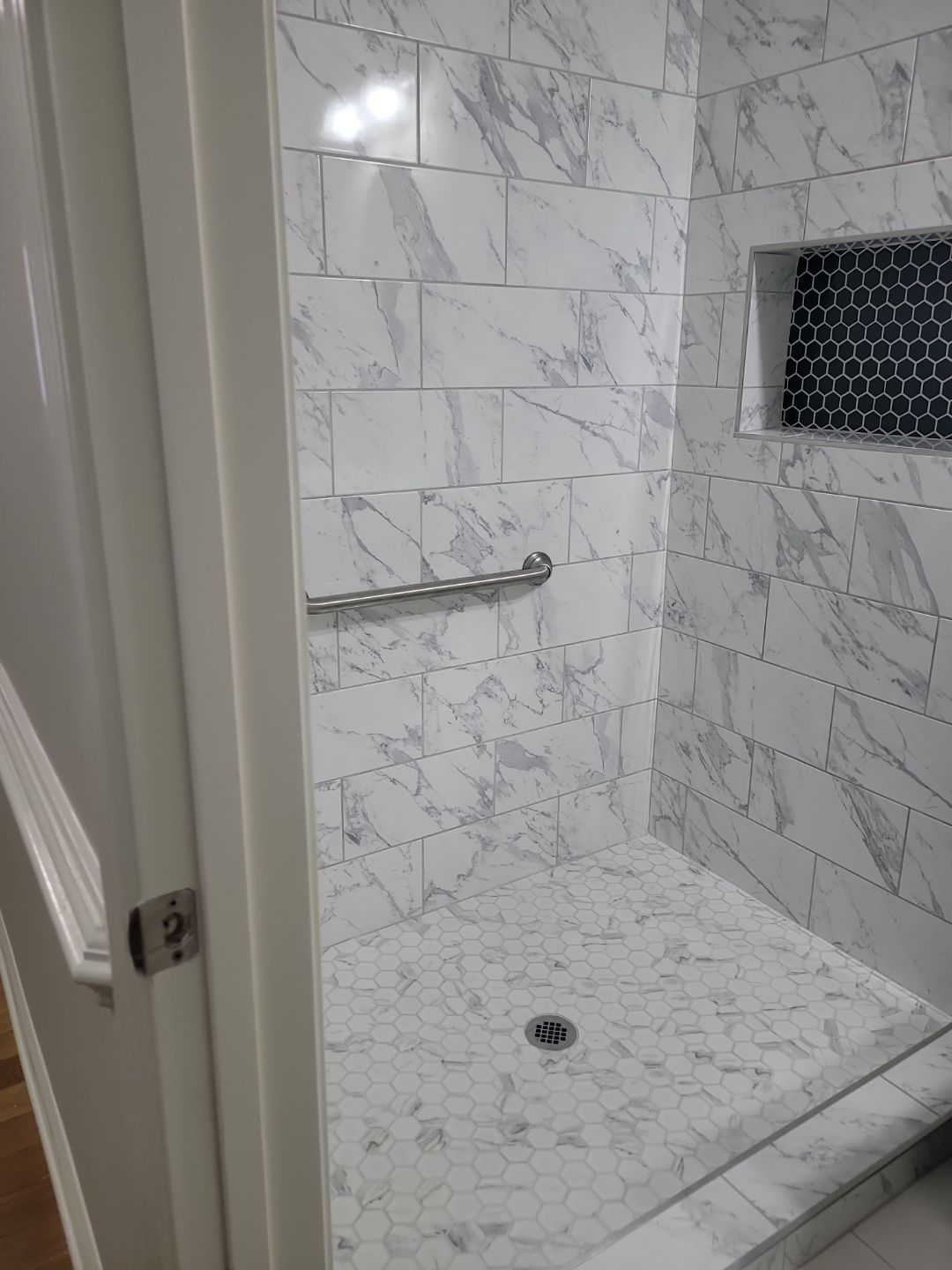 A Pathway to Possibility – Turning a Half Bath into a Full Retreat in Holly Springs by Elite Remodeling and Design LLC
