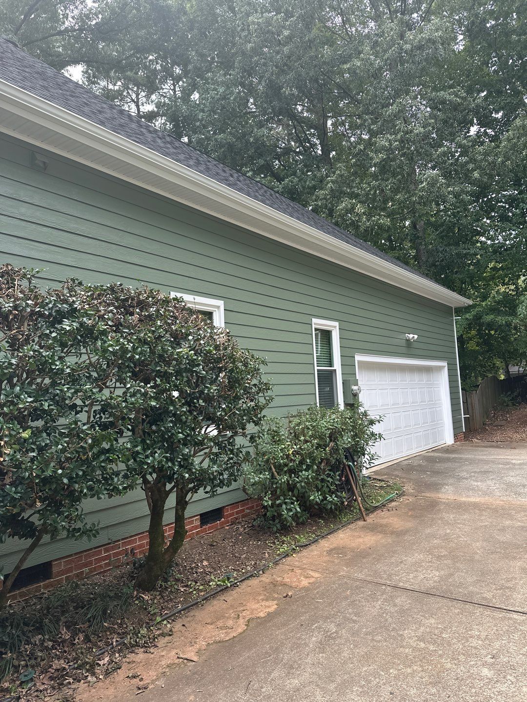 Raleigh Siding and Window Replacement with Custom Green Finish by The Remodeling Company