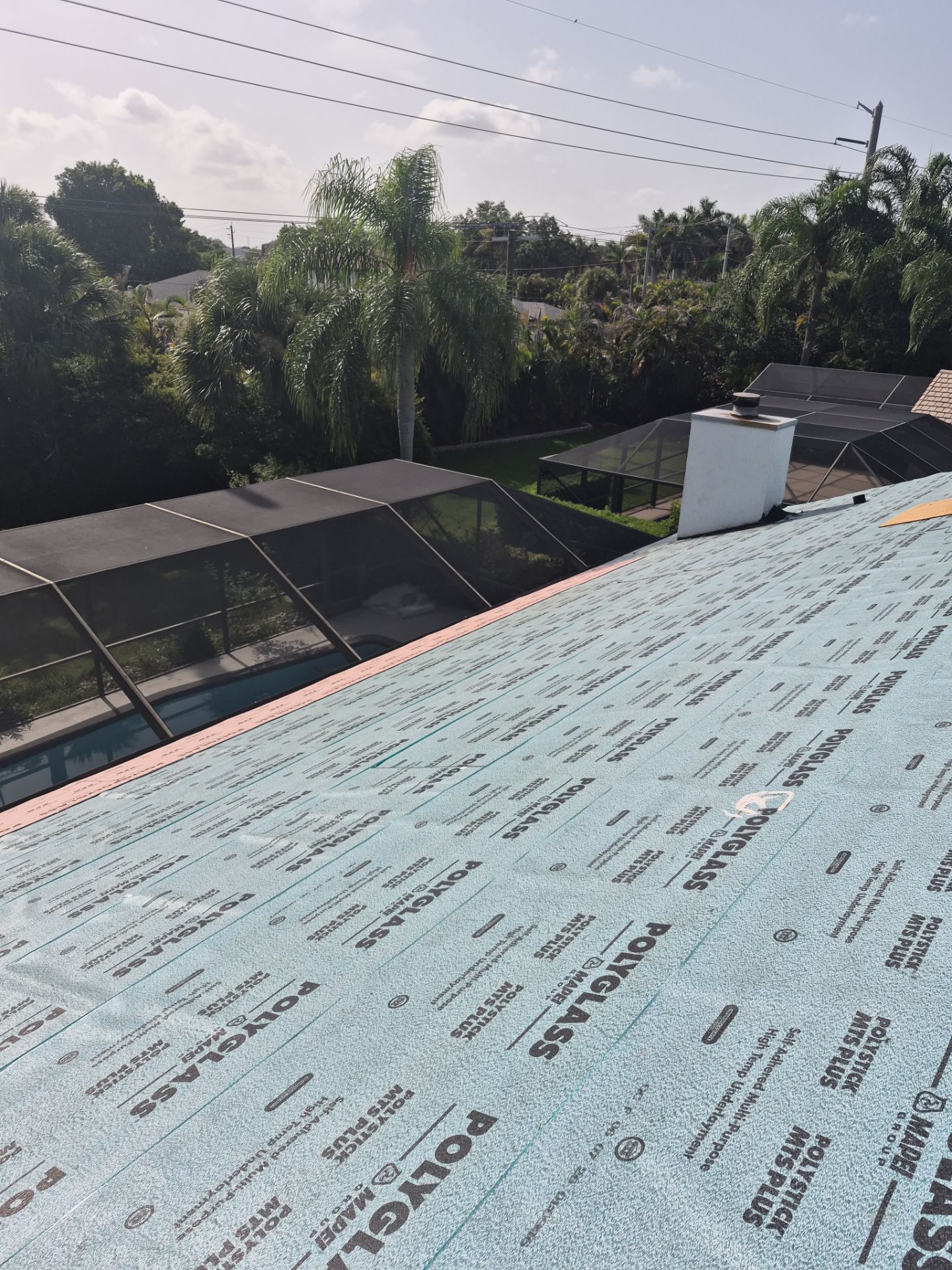 Standing Seam Metal Charcoal Grey Roof Replacement and Skylight Installation in Jupiter by Art's Roofing & Construction