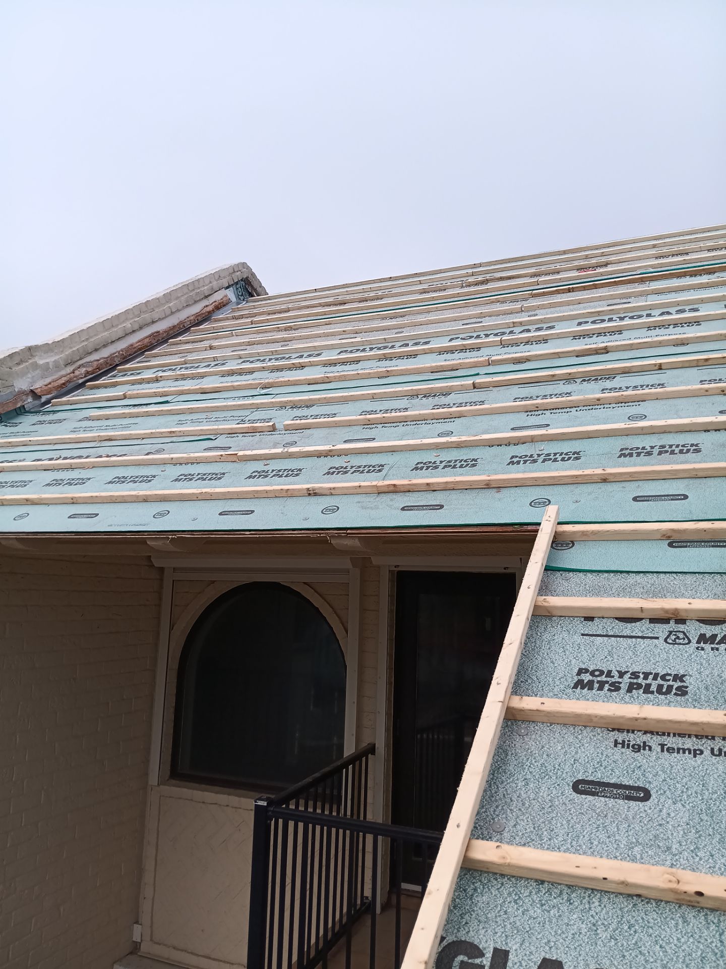 Off with the Tile and on with the TILCOR stone coated metal.  by Bayfront Roofing and Construction