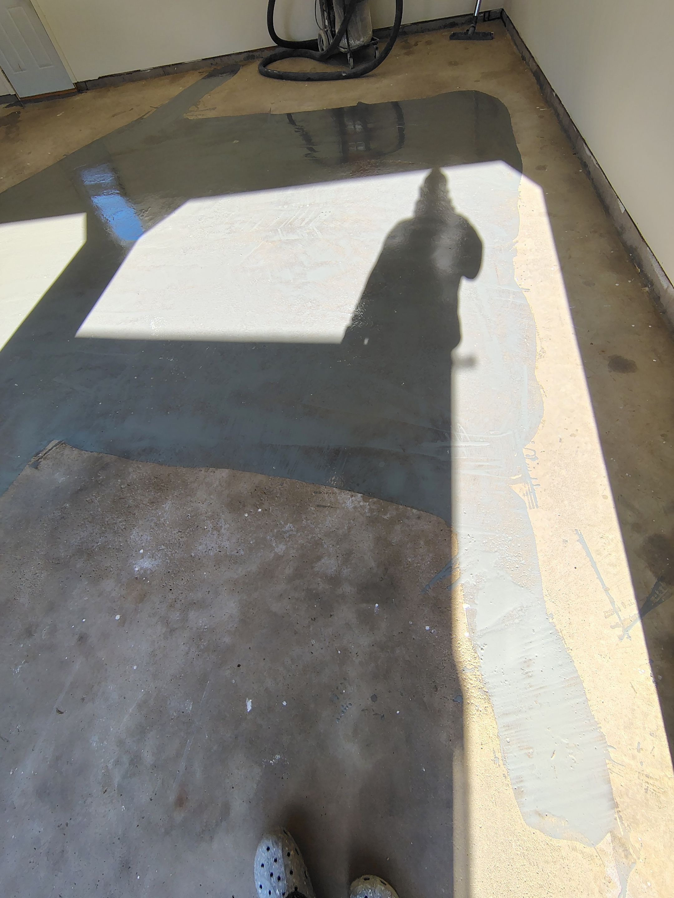 Full-Flake Epoxy Garage Floor Coating Installation in Sioux Falls by Select Painting, Coatings & Garage Cabinets