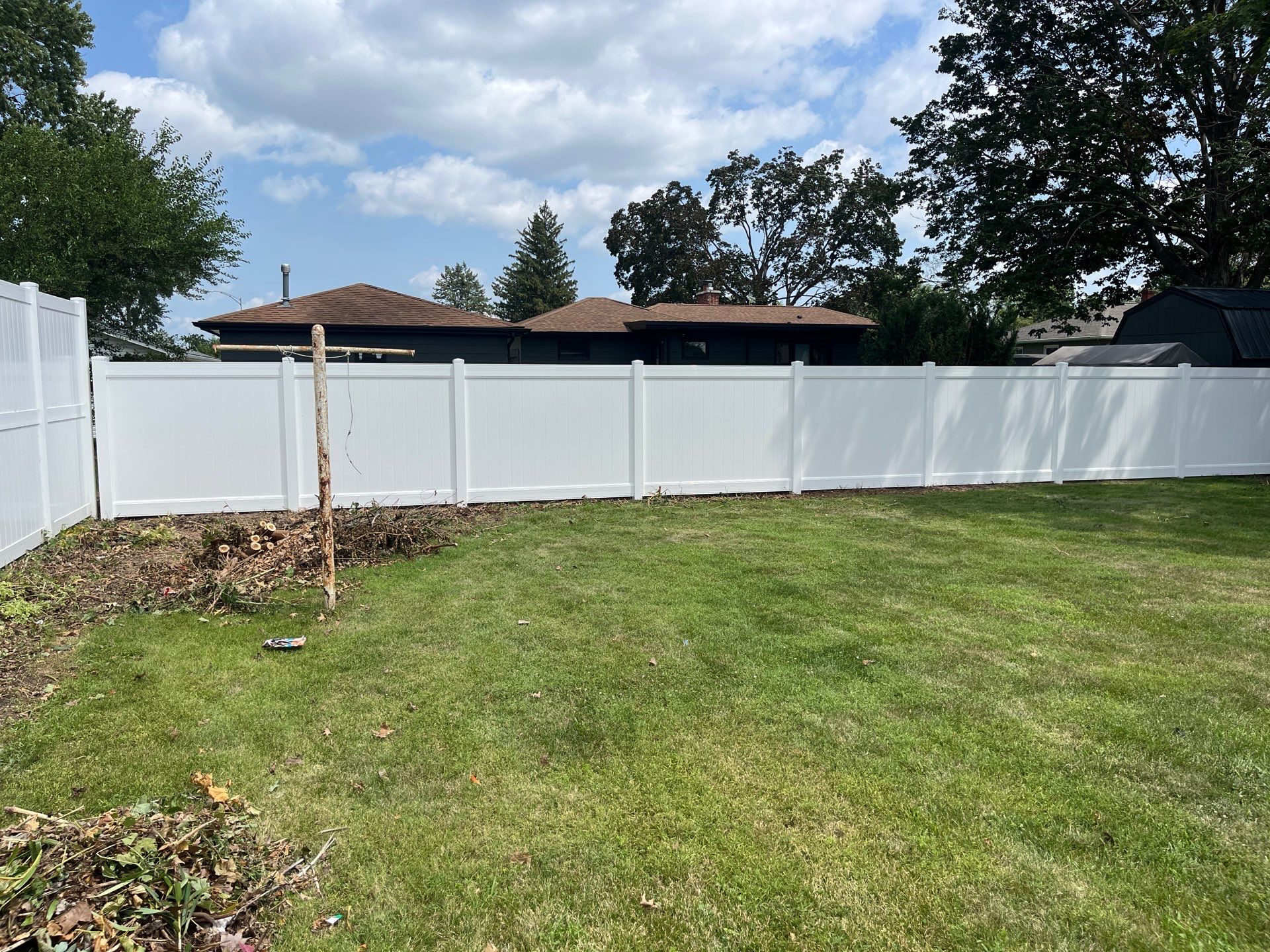 White Vinyl Privacy Fence Installation in Cedar Falls by Perfect Picket Fence and Stain