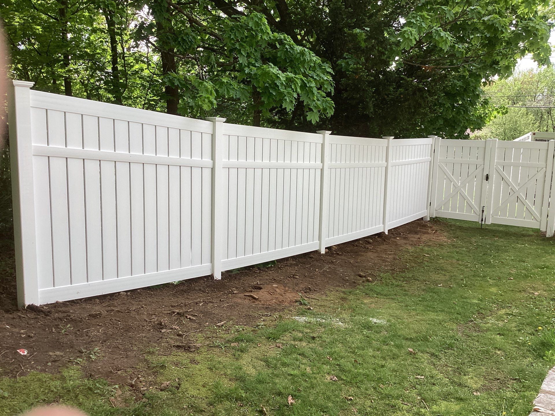 New White Semi privacy Vinyl Fence and matching gates by DiGiorgi Roofing and Siding Inc