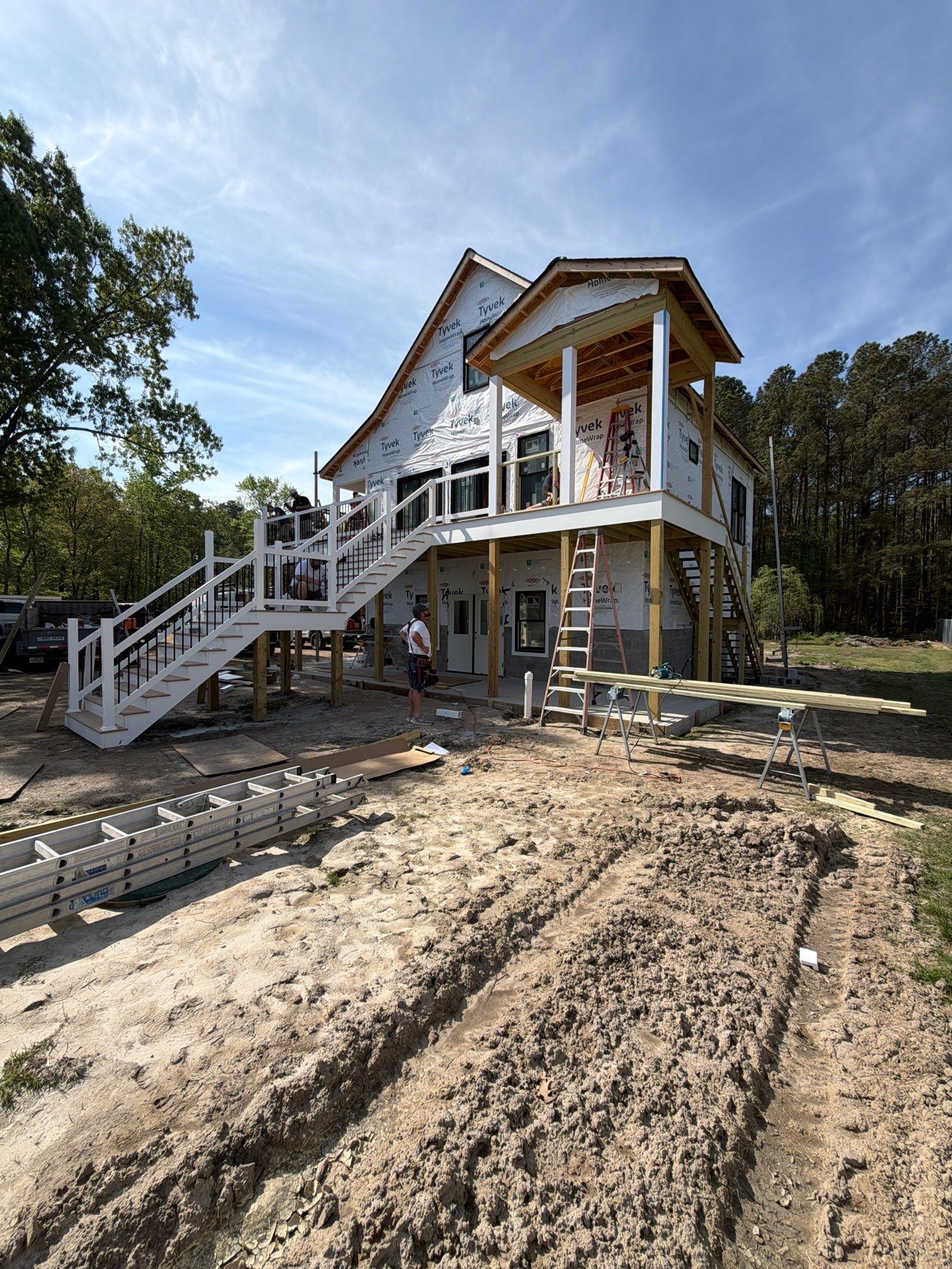 Two-Story Custom Home With Board and Batten Siding by Cade Construction