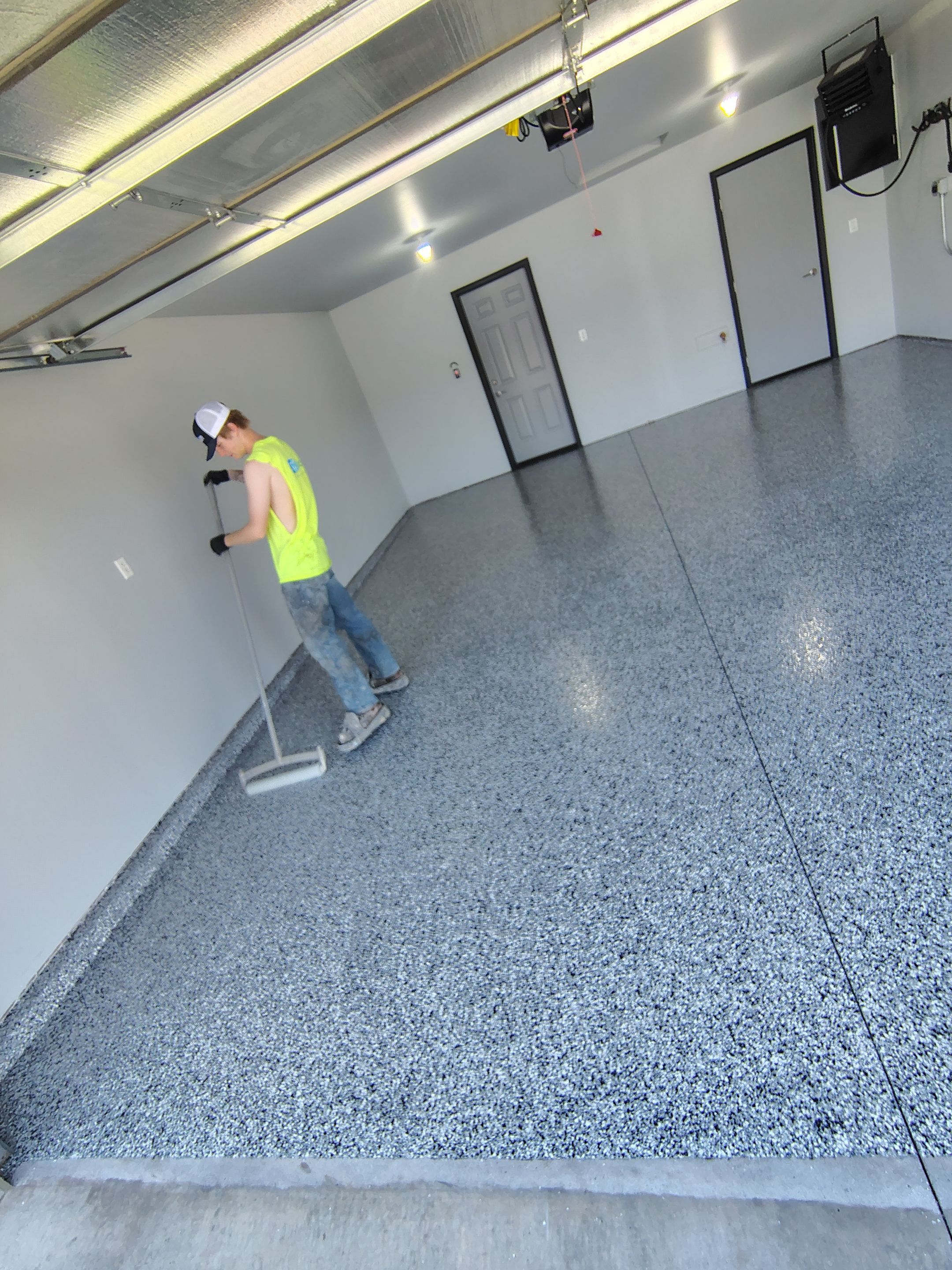Custom Epoxy Garage Floor Coating Installation in Sioux Falls by Select Painting, Coatings & Garage Cabinets