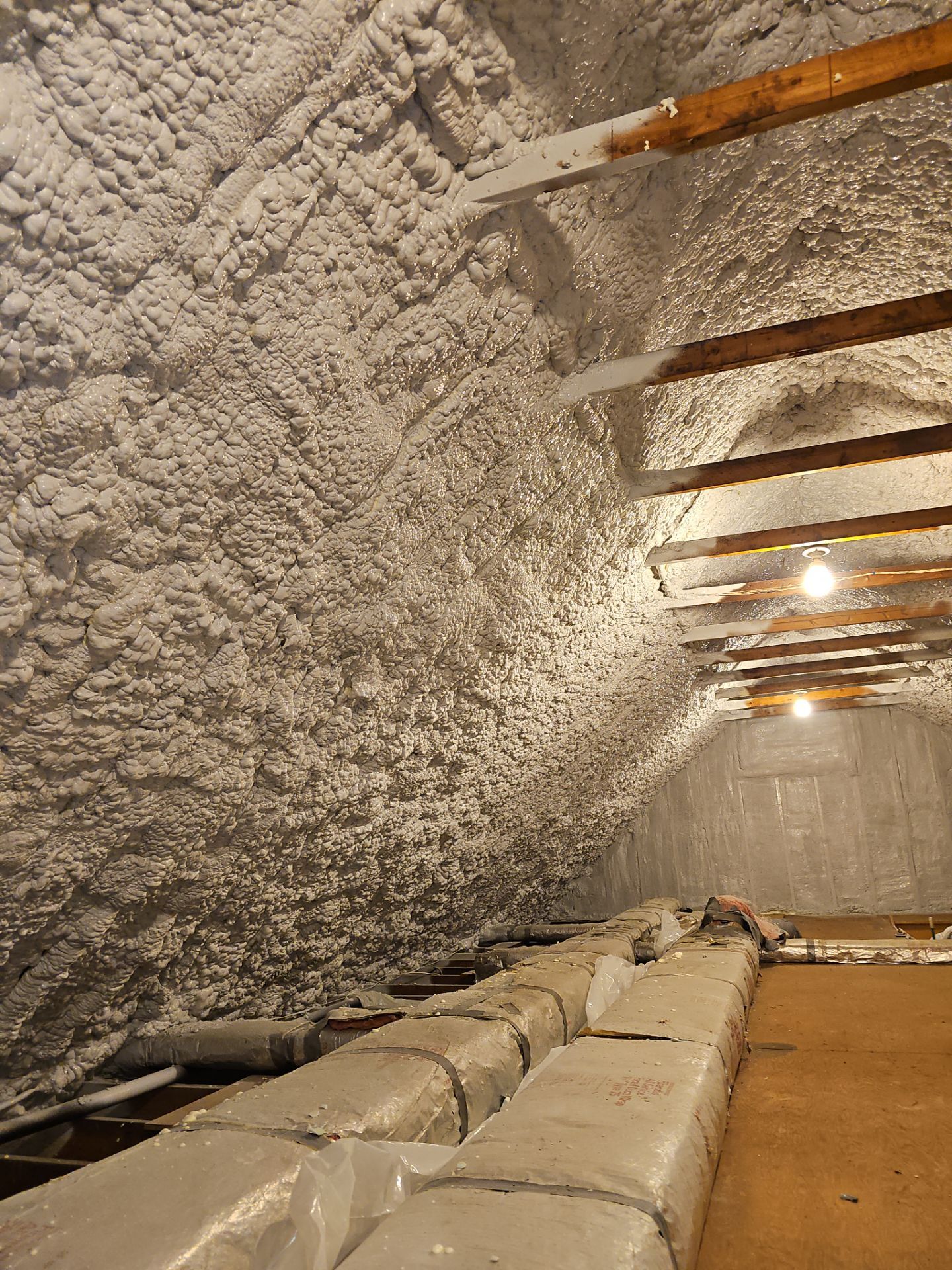 Attic Retrofit using open cell spray foam by NYS Foam & Energy