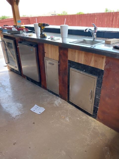Outdoor kitchen by Clays Services Inc