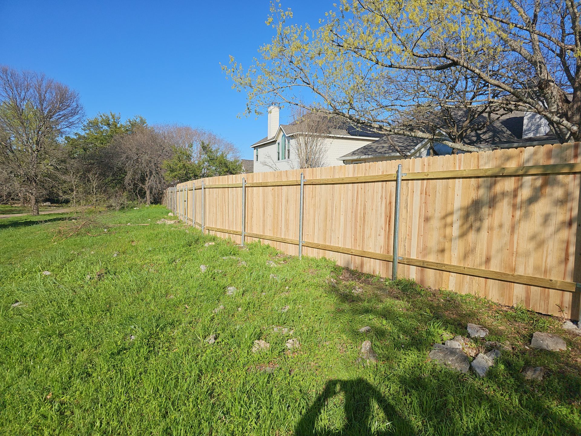 Fence Installation using Cedar Pickets by DeZign Roofing & Exteriors