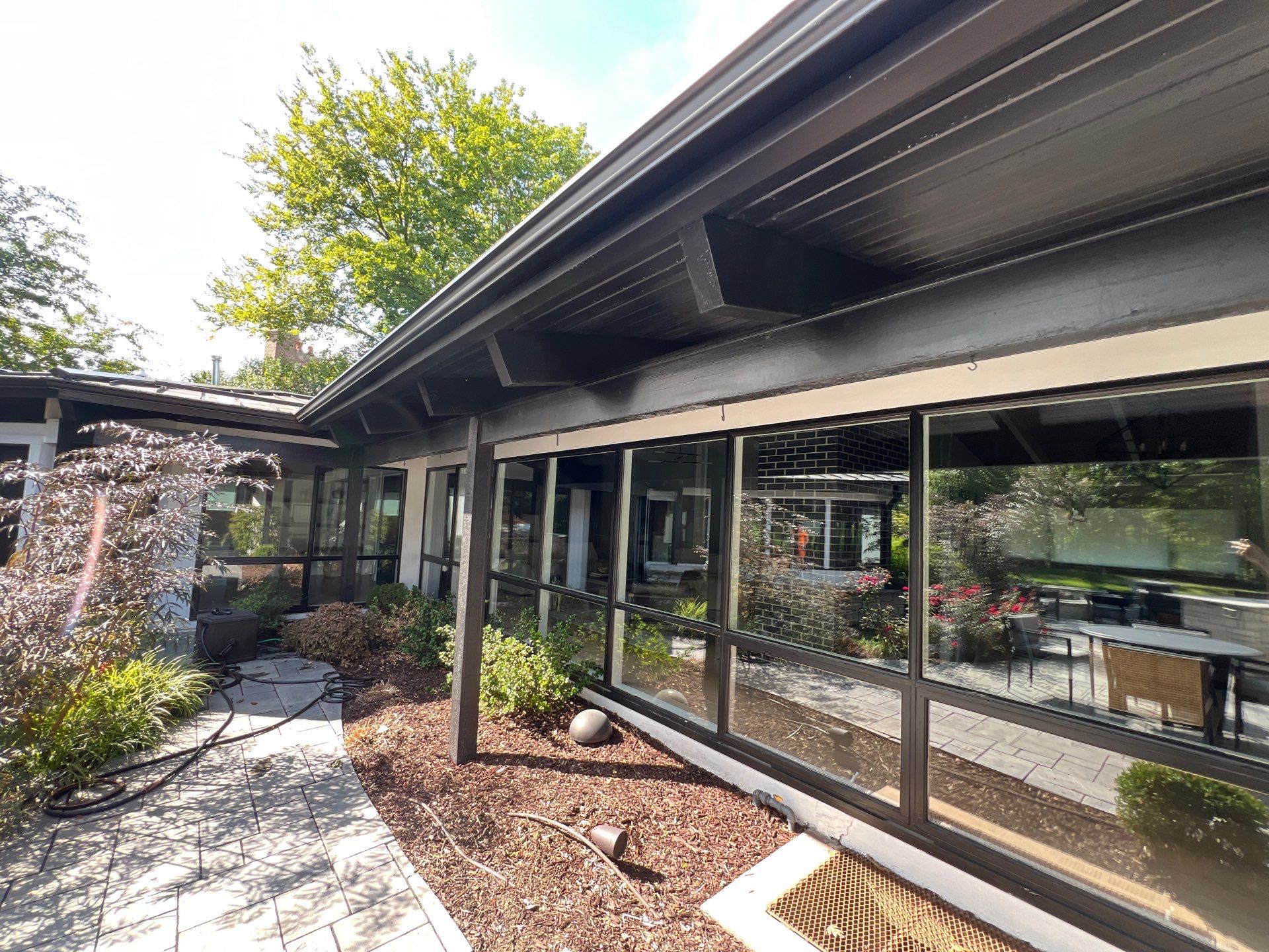 Complete Exterior House, Bluestone & Garage Floor Cleaning by Northern Power Washing LLC.