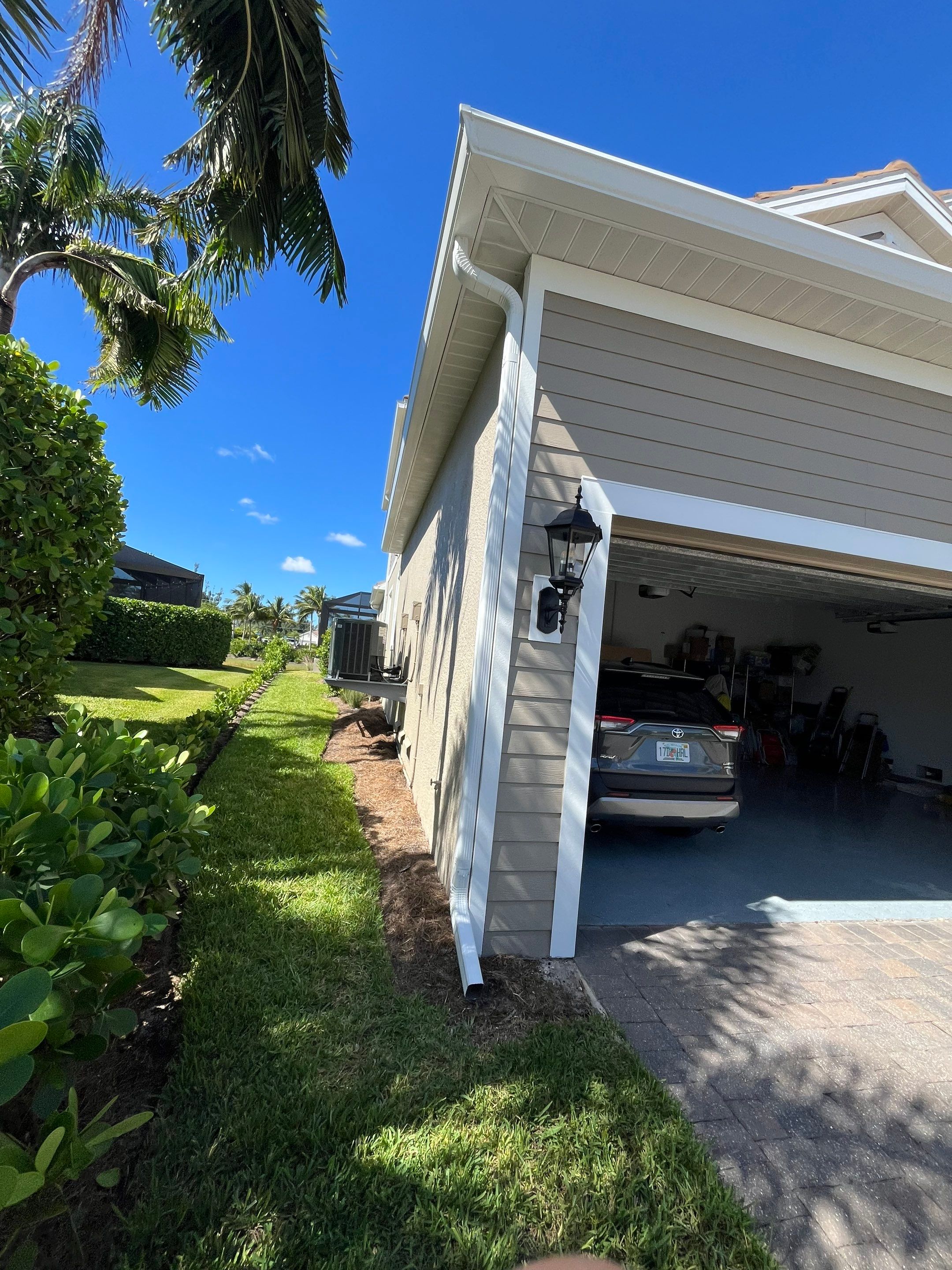 Bronze Downspouts & 7-Inch K-style Seamless Gutter Installation in Fort Myers FL by Gutter Professors