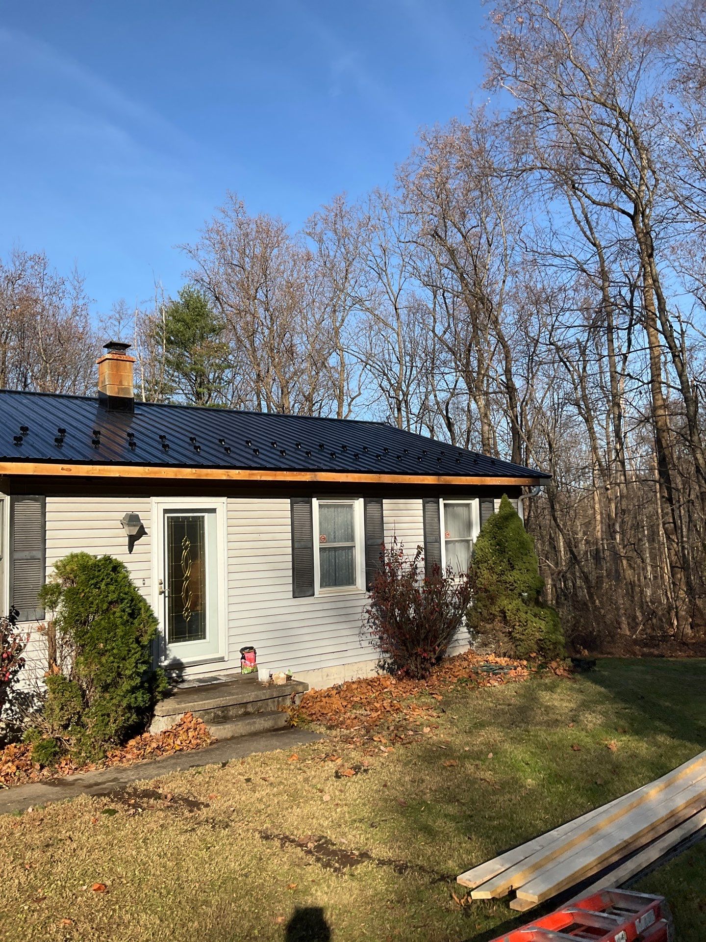 Dalmatia Metal Roofing and Custom Timber Entry Portico by Esh Builders