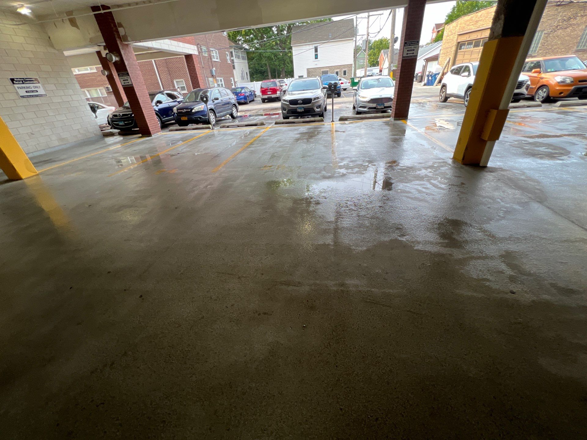 Parking garage using Hot water by Northern Power Washing LLC.