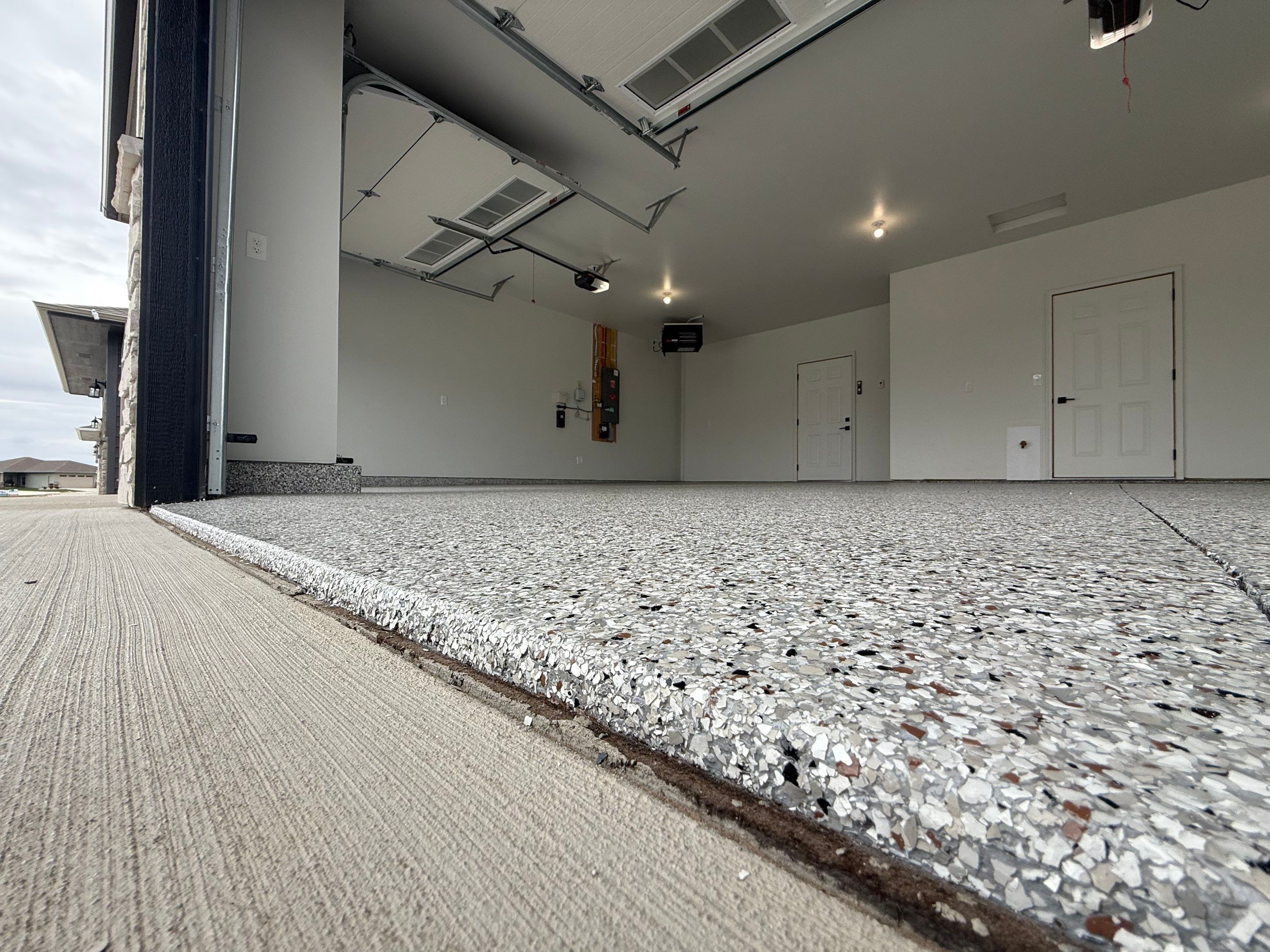 High-Gloss Epoxy Flake Garage Floor Coating in Brandon by Select Painting, Coatings & Garage Cabinets
