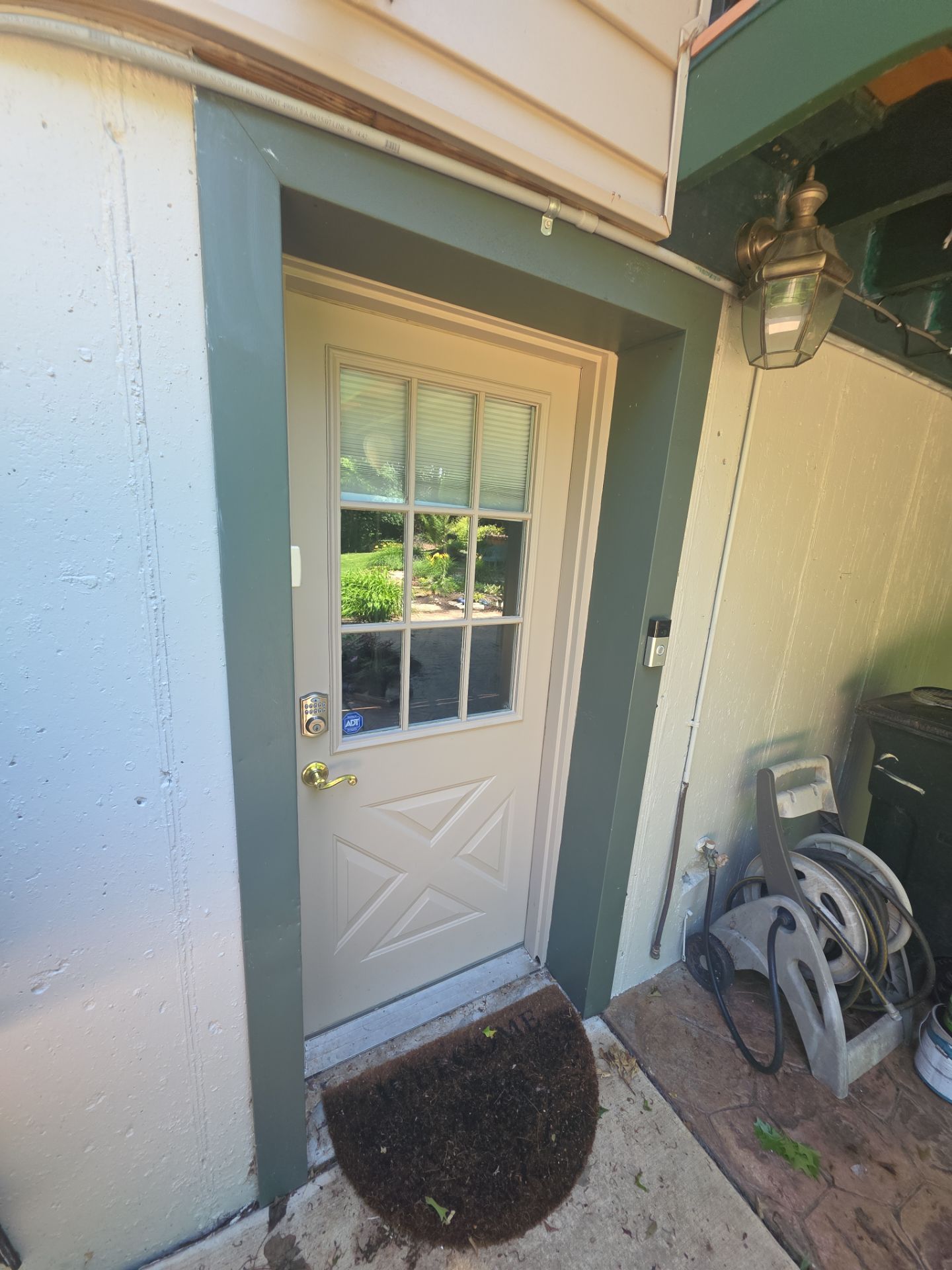 Exterior Entry Door and Garage Door Painting by Legendary Services Company LLC.
