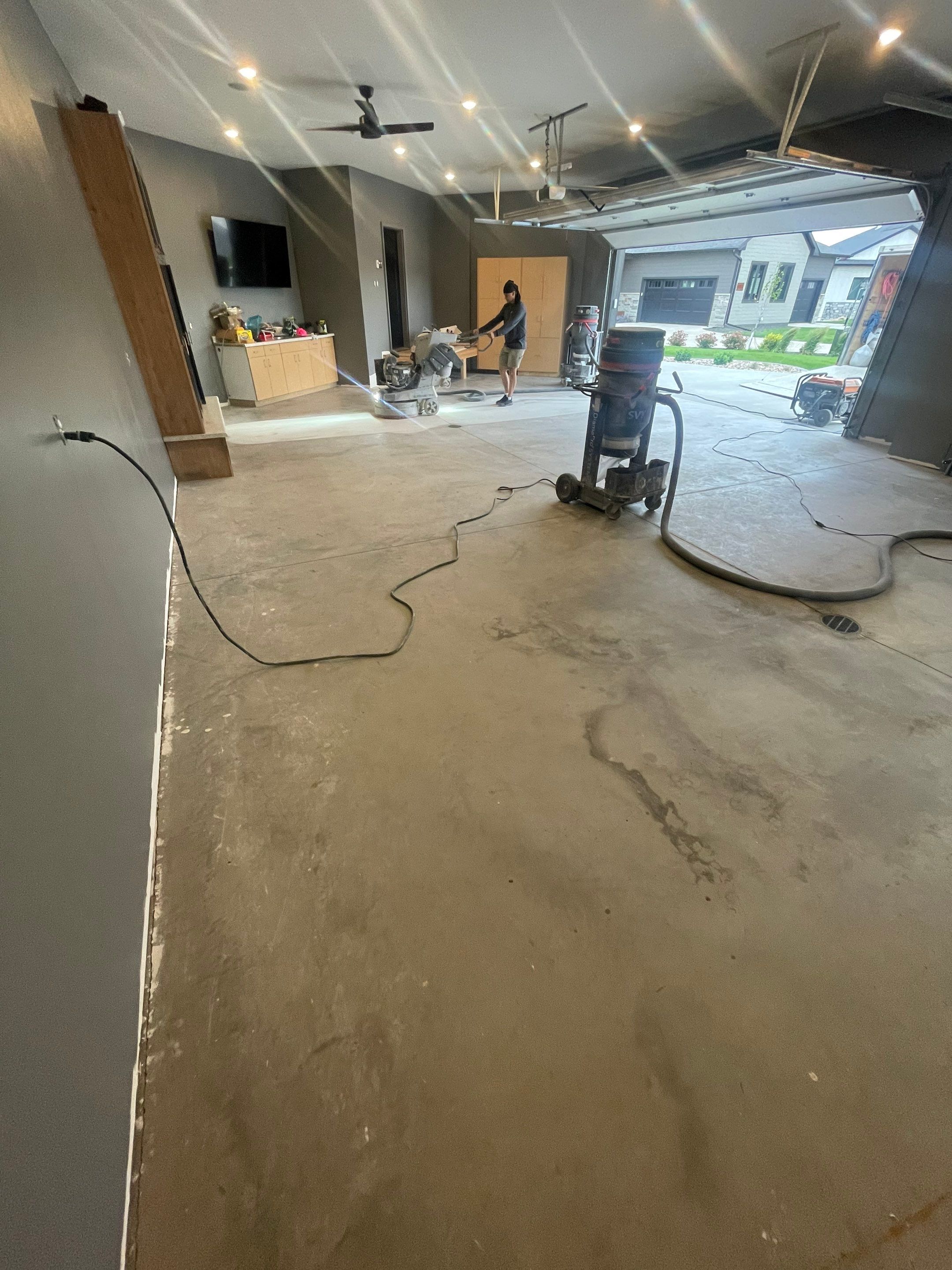 Custom Speckled Concrete Coating for Dell Rapids Garage by Select Painting, Coatings & Garage Cabinets