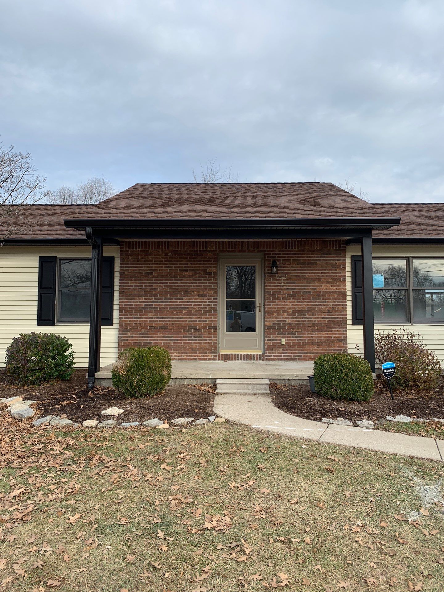 New Black Gutters, Post Wrap, and Garage Wrap by Storm Contracting 