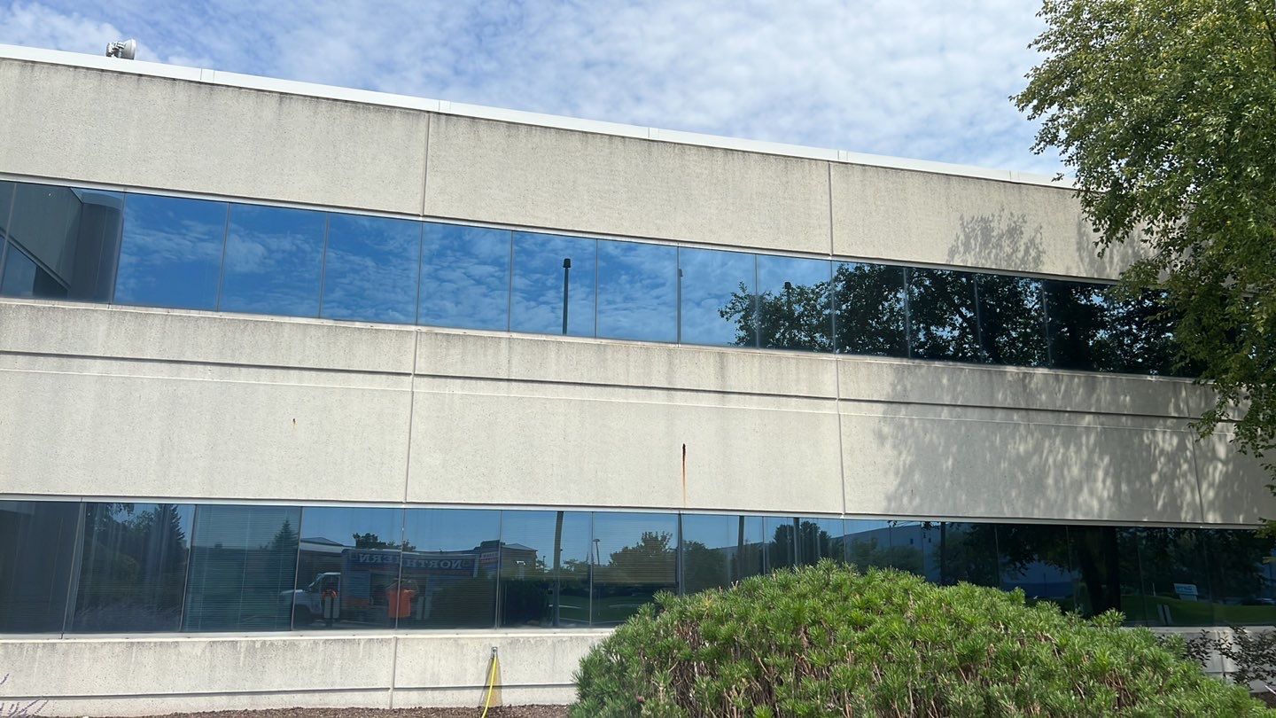 commercial pressure washing using Algaecide, soft wash soap by Northern Power Washing LLC.