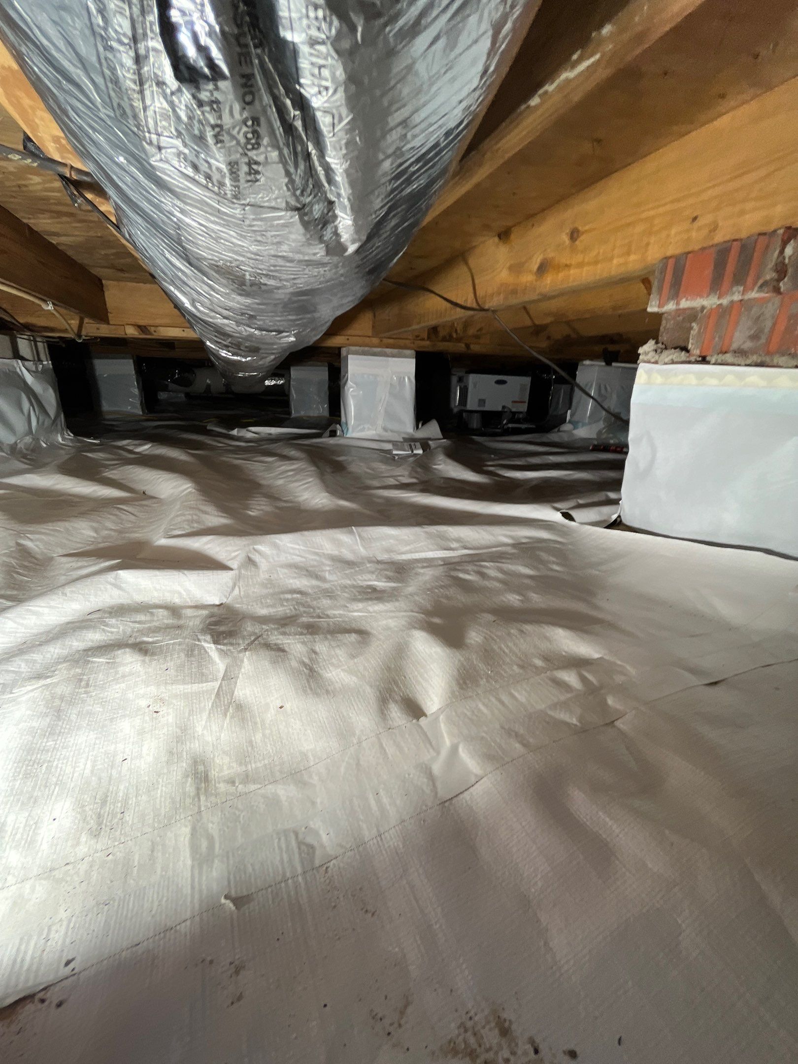 Crawlspace remediation & encapsulation with ductwork replacement by EAS Environmental, LLC.