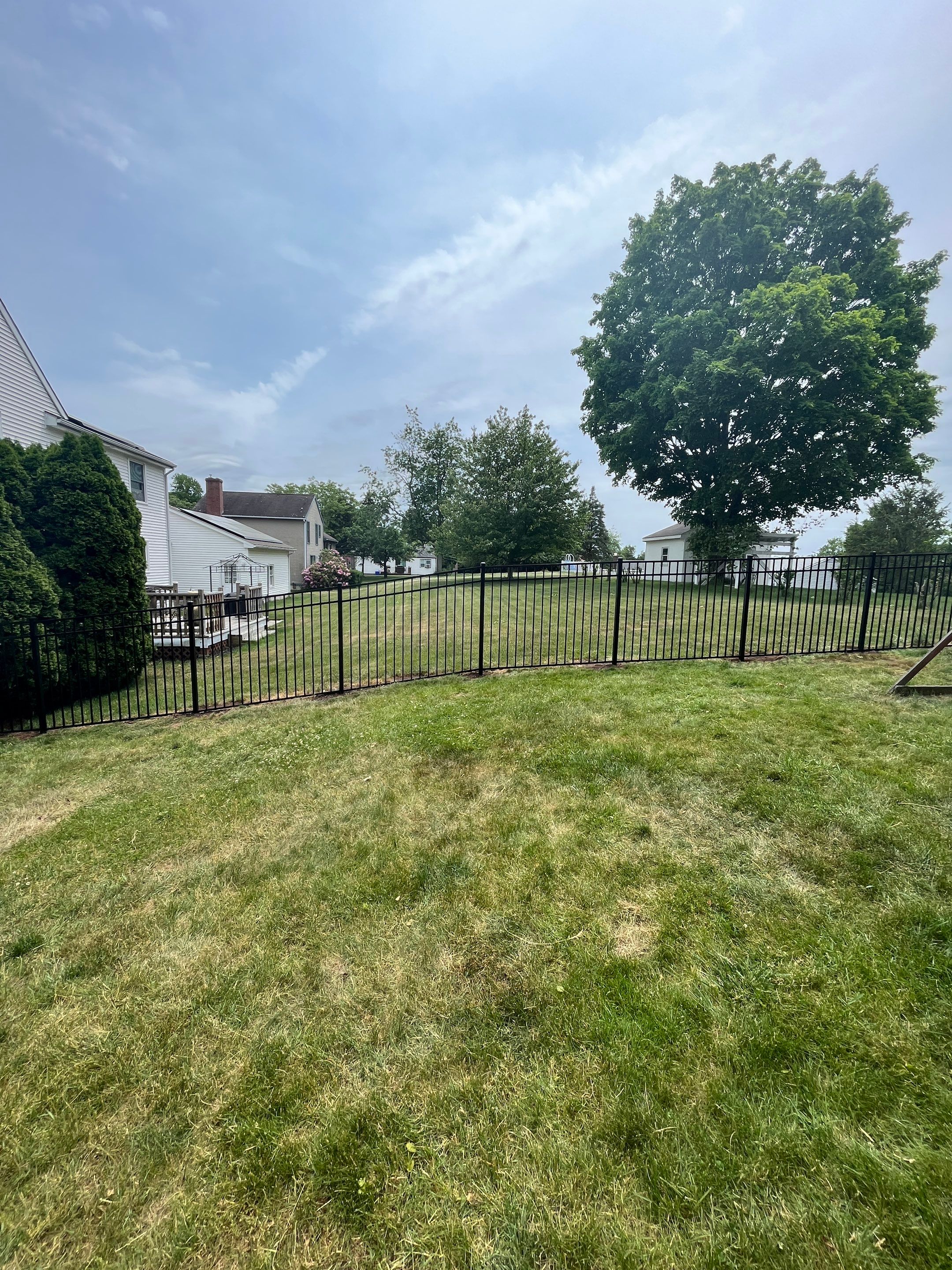 Aluminum Fence in Black, with matching Arched gate by DiGiorgi Roofing and Siding Inc