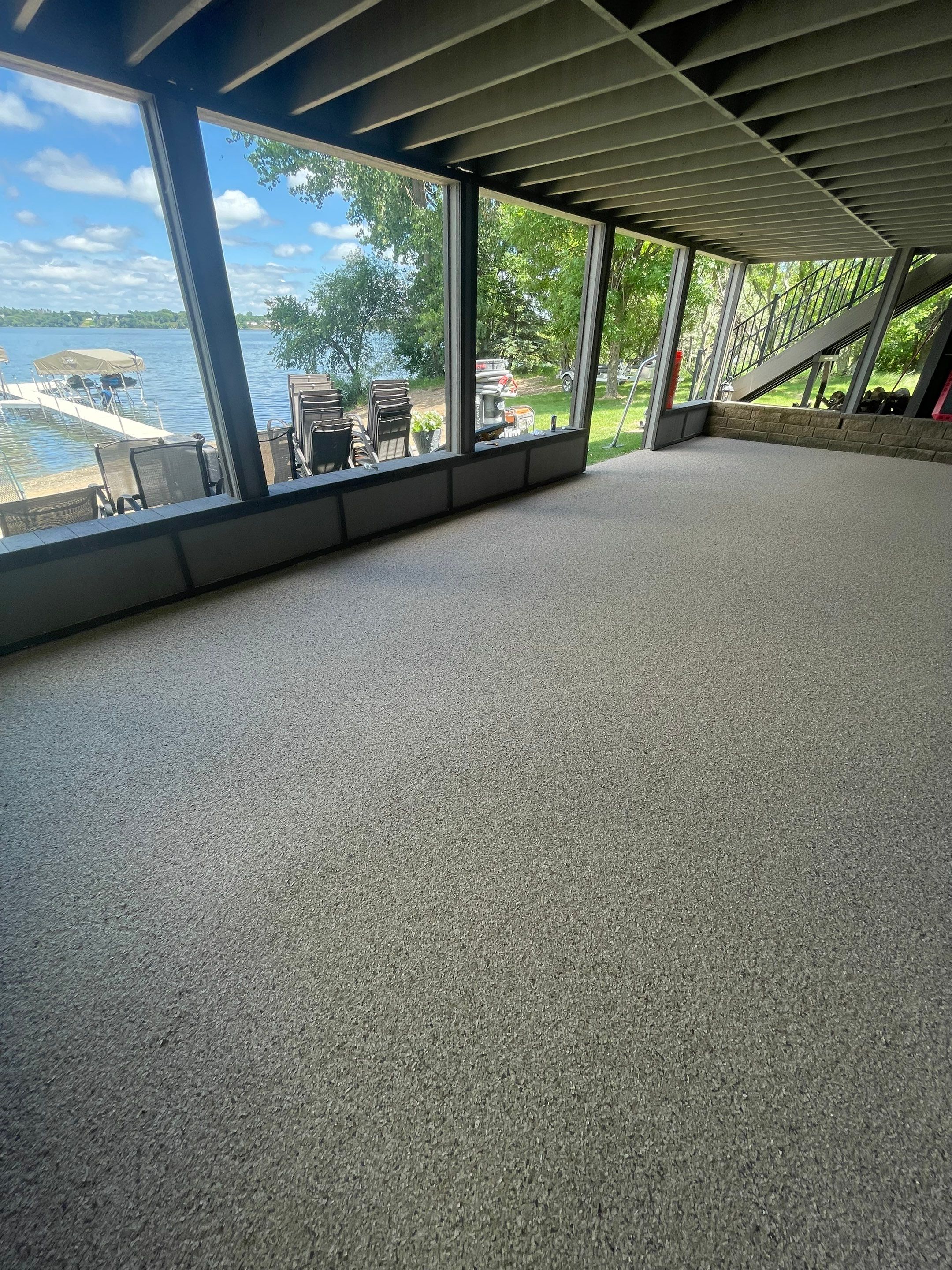Lakefront Screened Patio Concrete Coating Installation in Wentworth by Select Painting, Coatings & Garage Cabinets