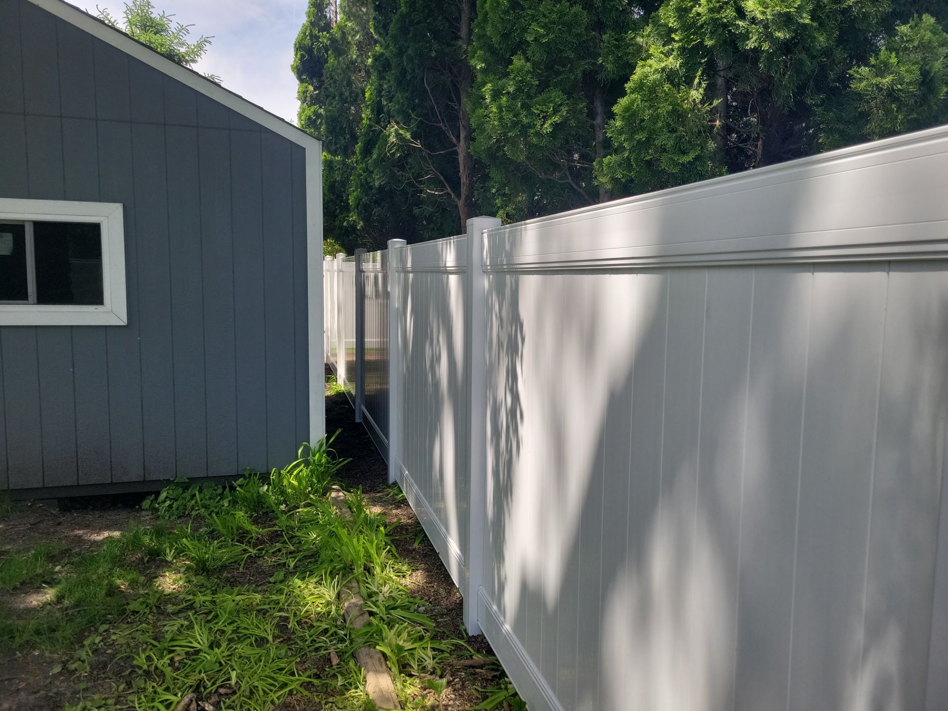 Residential White Vinyl Privacy Fence Installation in Waterloo by Perfect Picket Fence and Stain