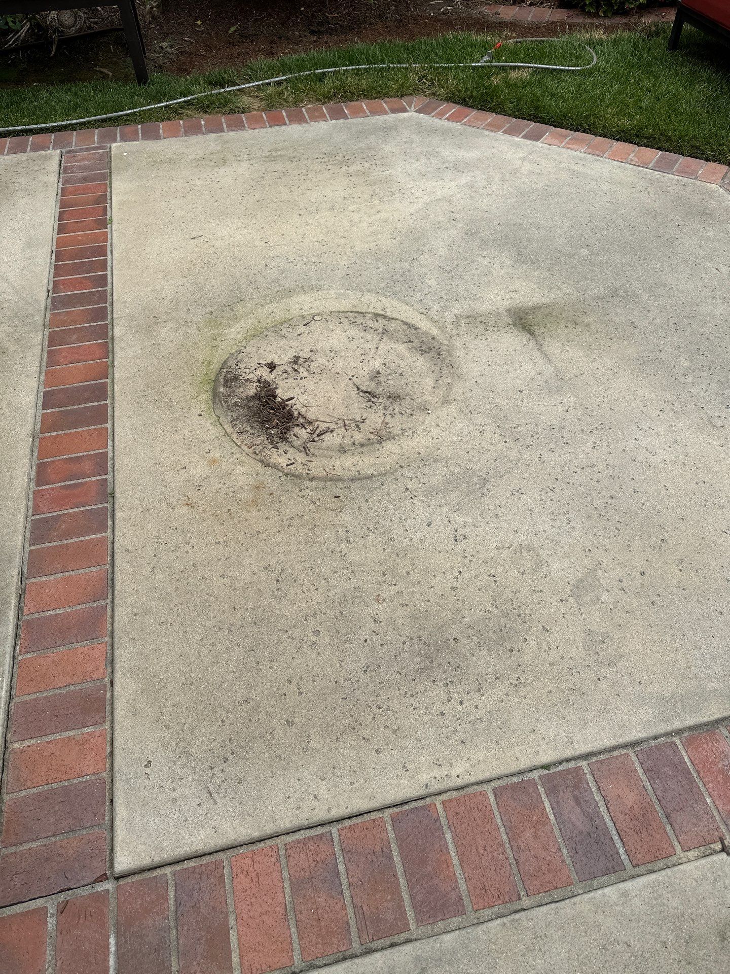 Surface cleaning pressure washing in Orange County on patio, walkways, and driveway by Property Cleaning Experts, LLC