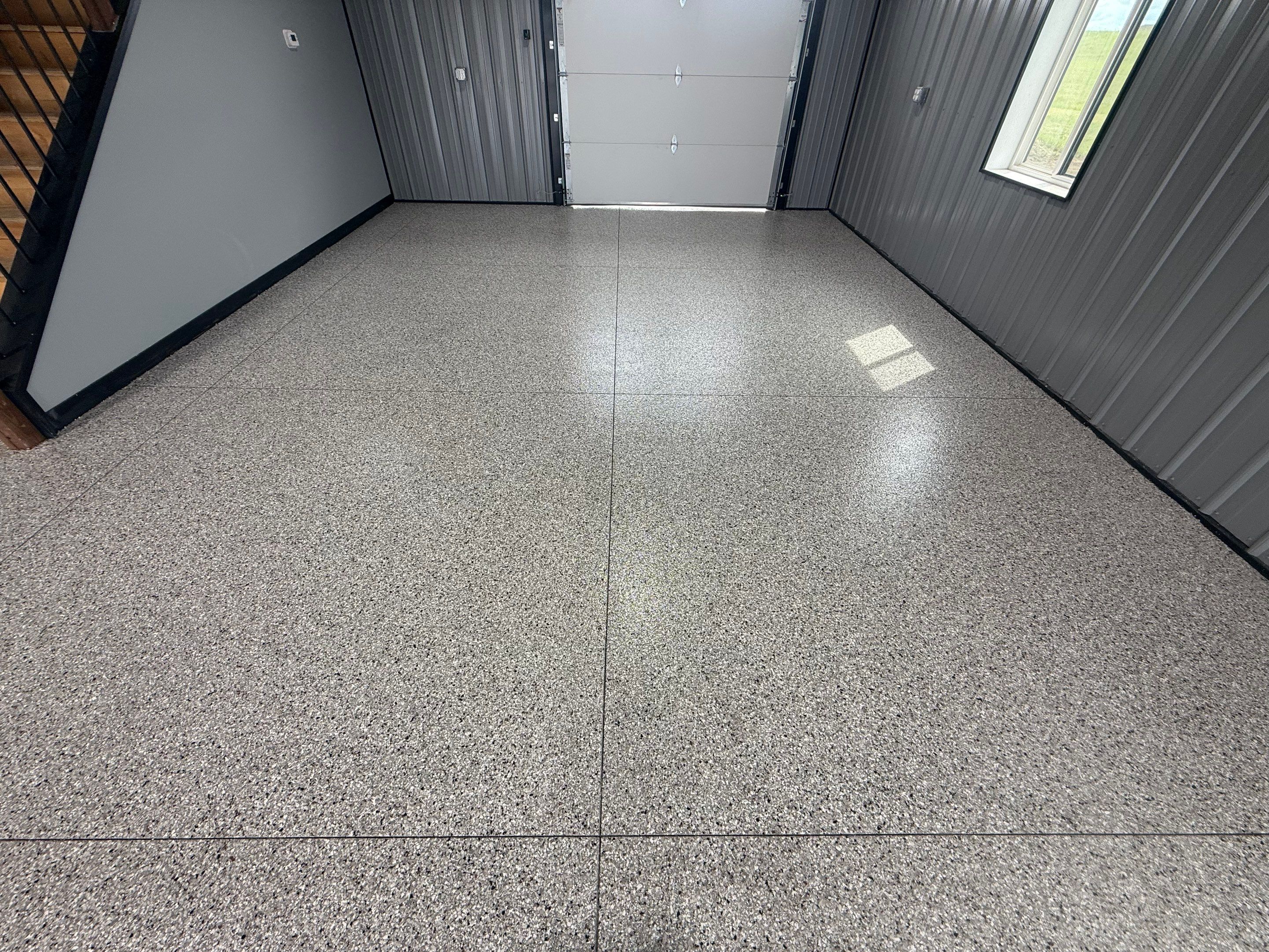 Polyaspartic Garage Floor Coating with Decorative Flake in Wentworth by Select Painting, Coatings & Garage Cabinets