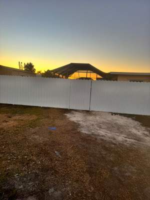White Vinyl Privacy Fence Installation in Bradenton, Florida