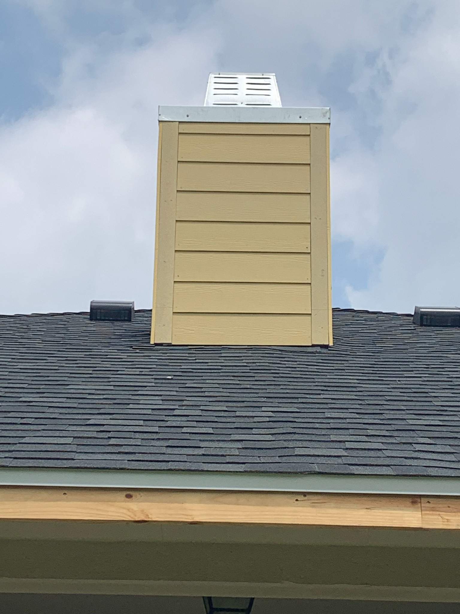 Nothing looks nicer than a little black roof by Bayfront Roofing and Construction