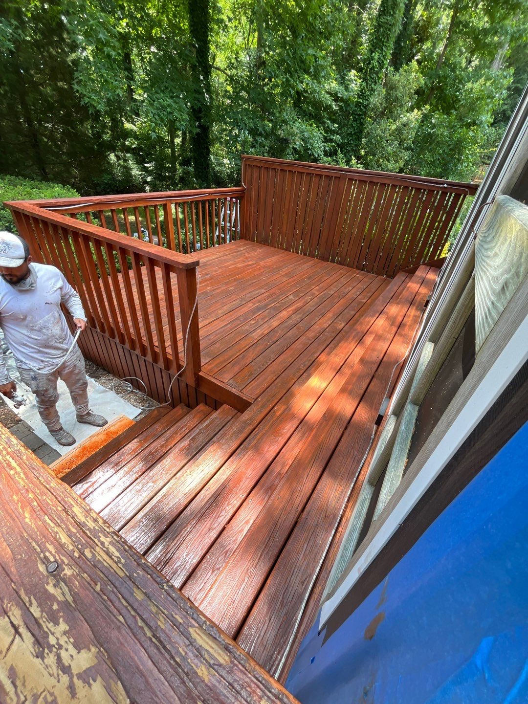 Triple deck re-staining by AKK Painting LLC