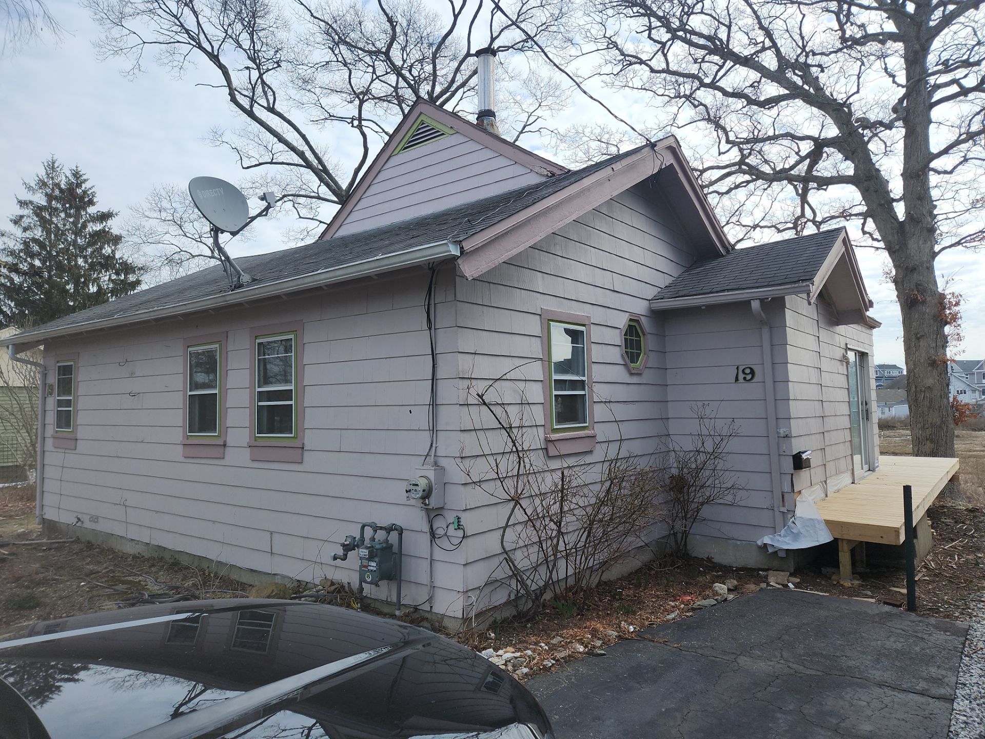 Milford Exterior Renovation Featuring Custom Siding and Wood Deck Installation by A Plus Exterior
